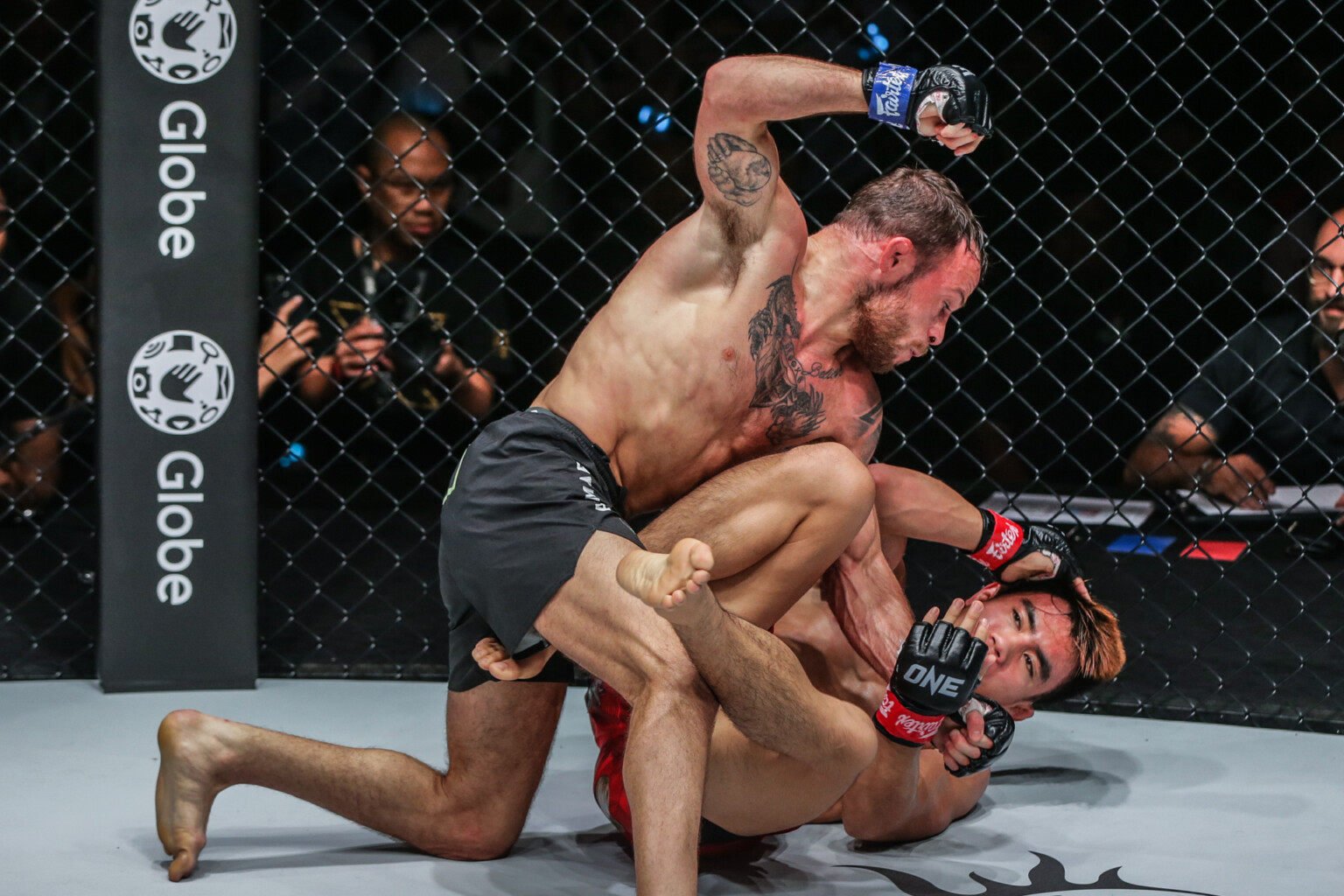 Jarred Brooks punches Joshua Pacio during their first strawweight title fight in 2022. Photo: ONE Championship