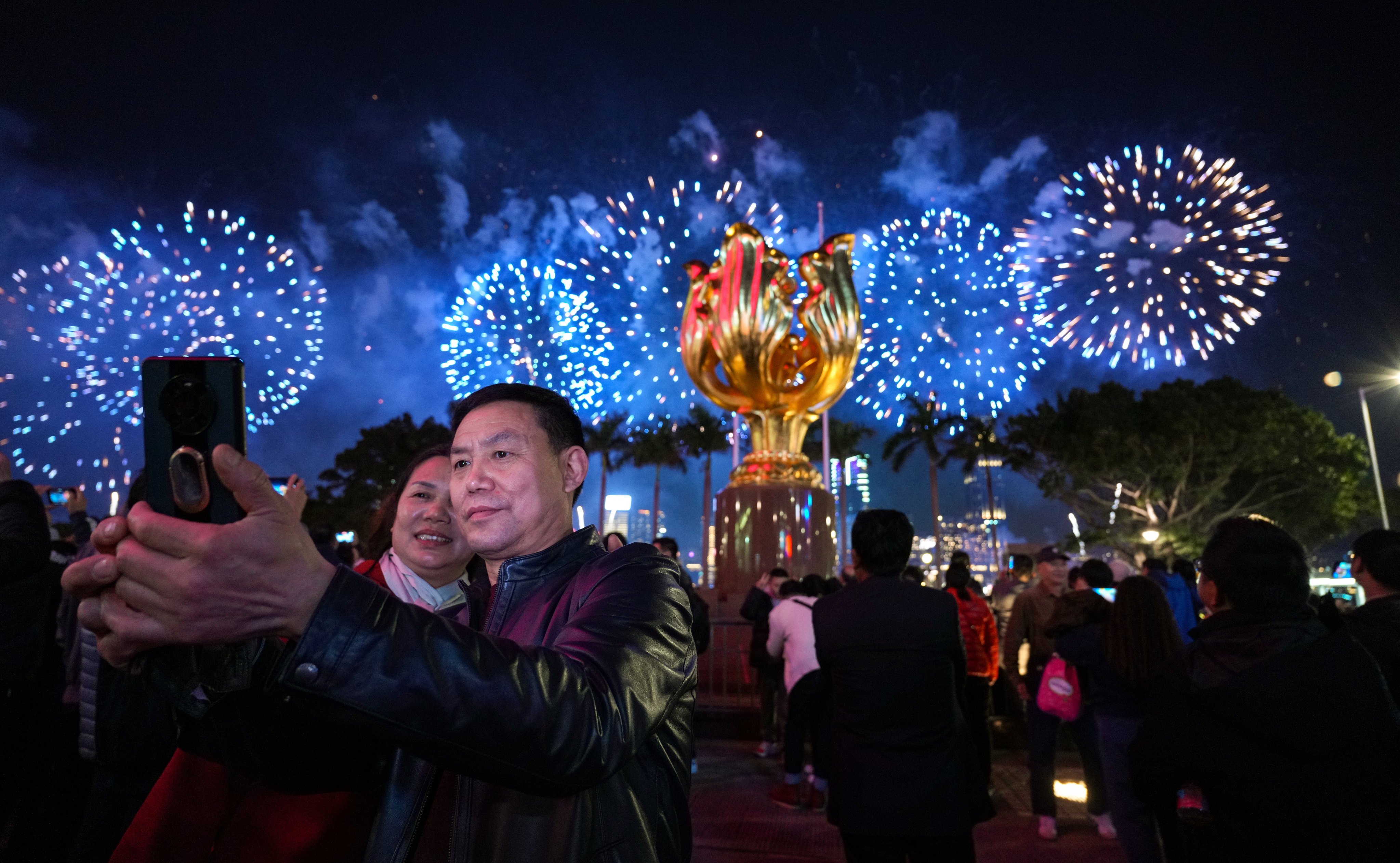 Visitors gather for a fireworks display  at Golden Bauhinia Square during the Lunar New Year. Photo: Eugene Lee