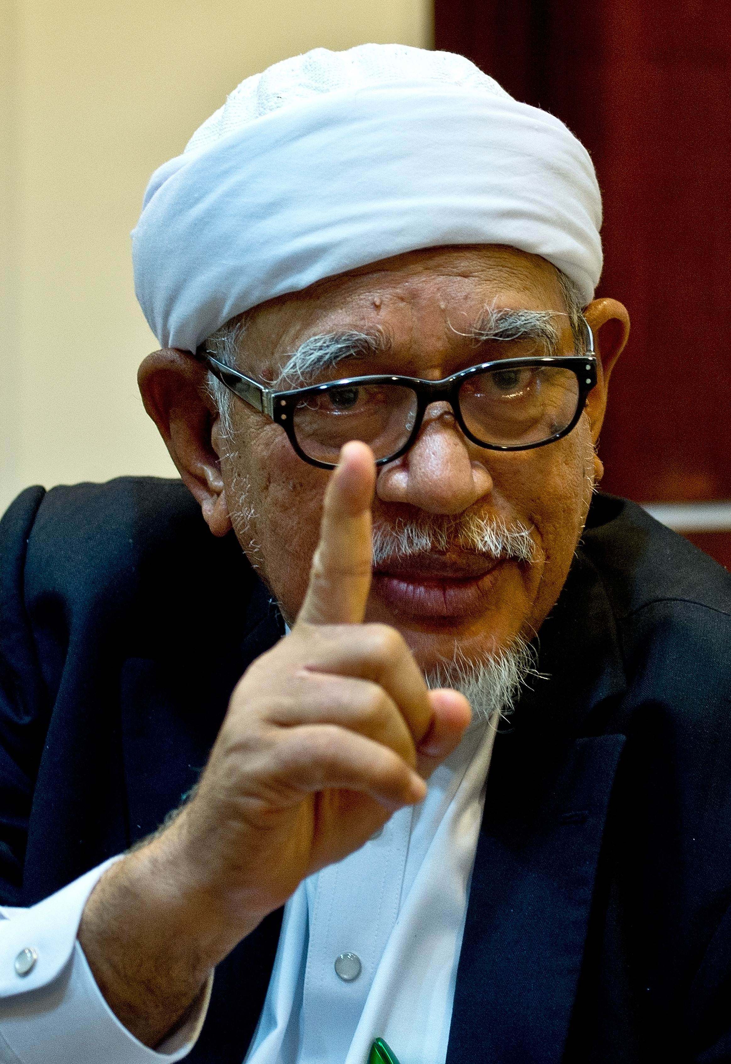 Malaysian Islamic Party (PAS) president Hadi Awang gestures during an interview at the party HQ in Kuala Lumpur in 2015. Photo: AFP