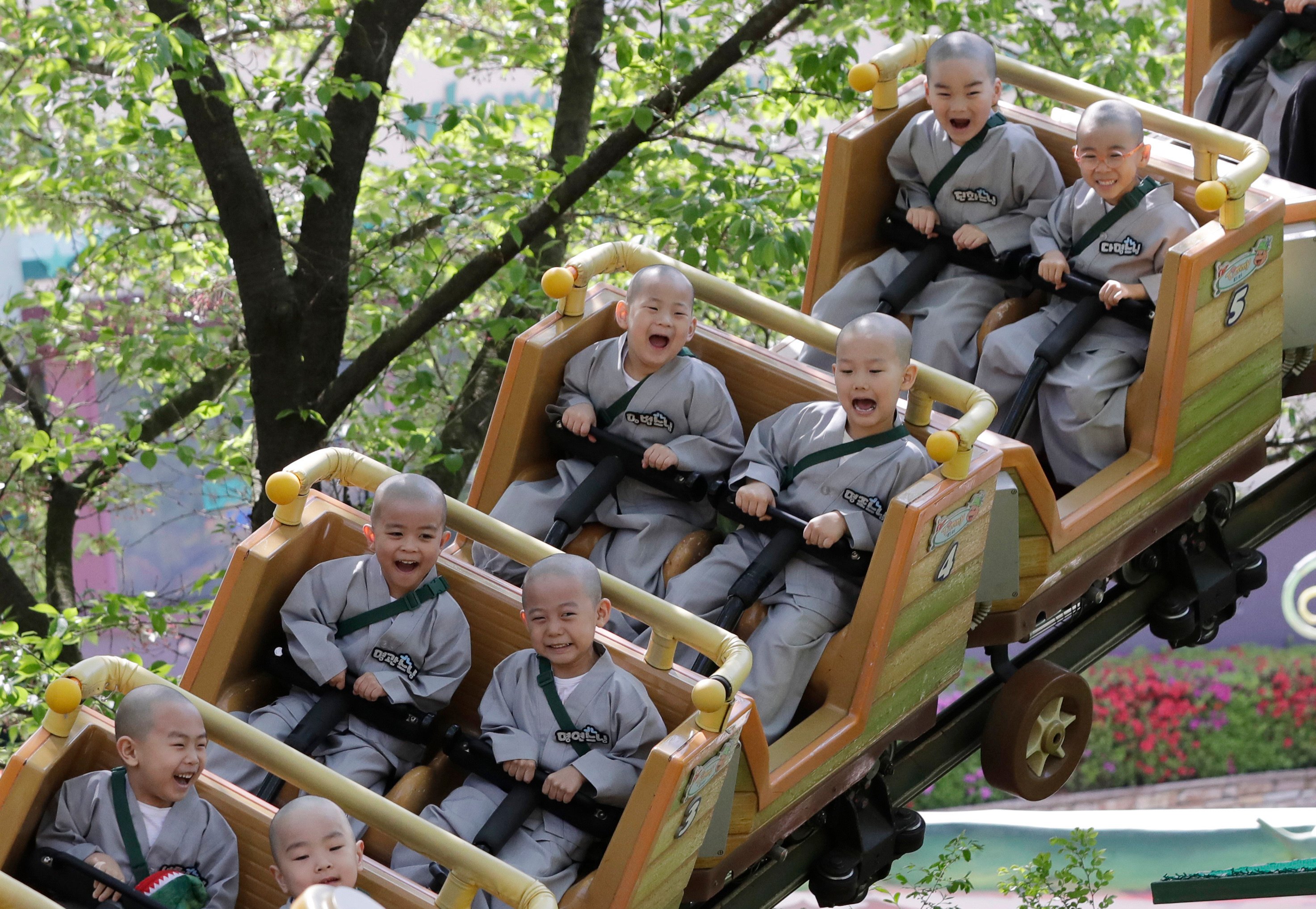 Children ride a roller coaster at an amusement park in Yongin, South Korea. Since 2018, the country has been the only OECD member to have a birth rate below 1. Photo: AP