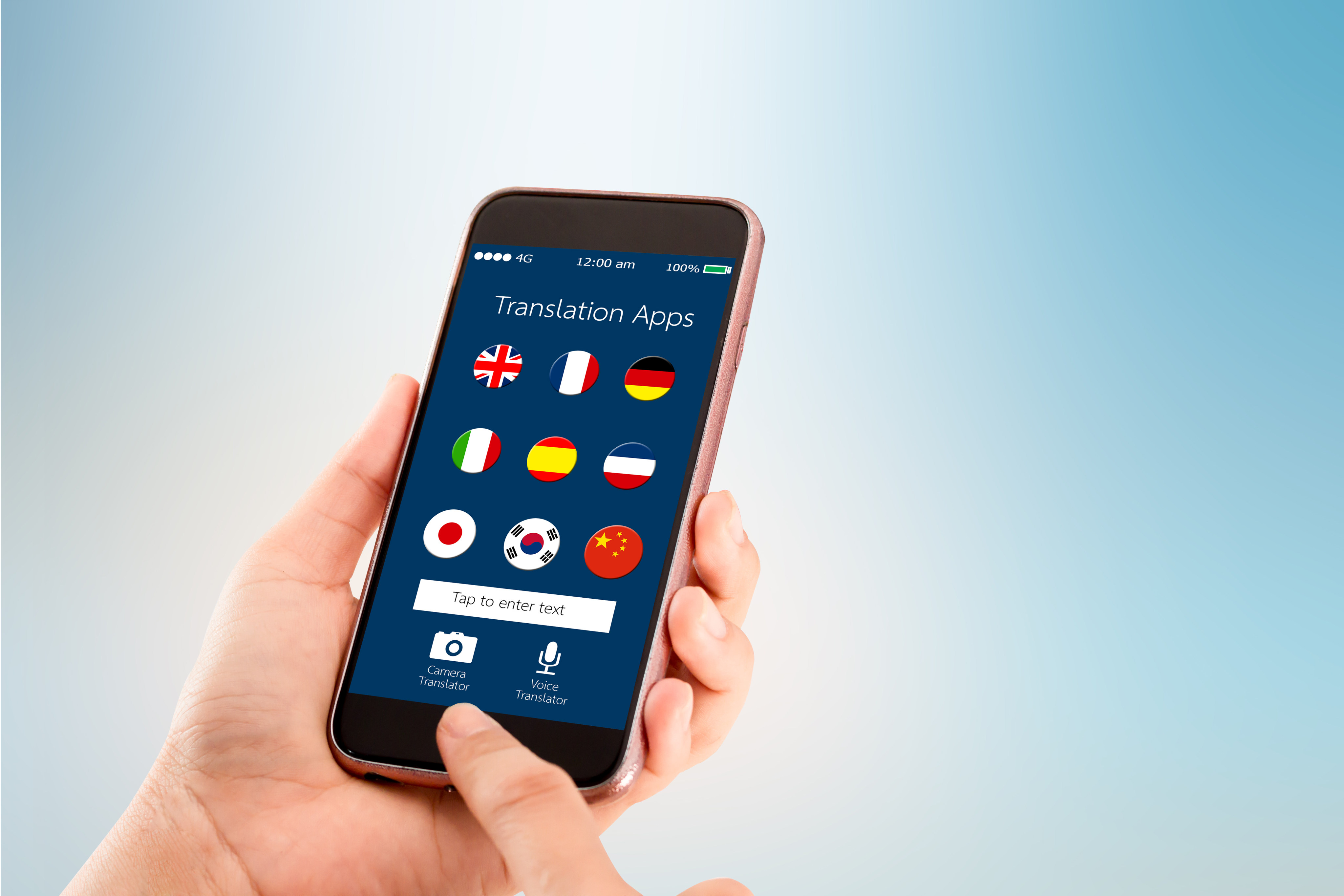 mobile translation application concept.Hand holding mobile phone on blurred abstract backgrounds. Photo: Shutterstock