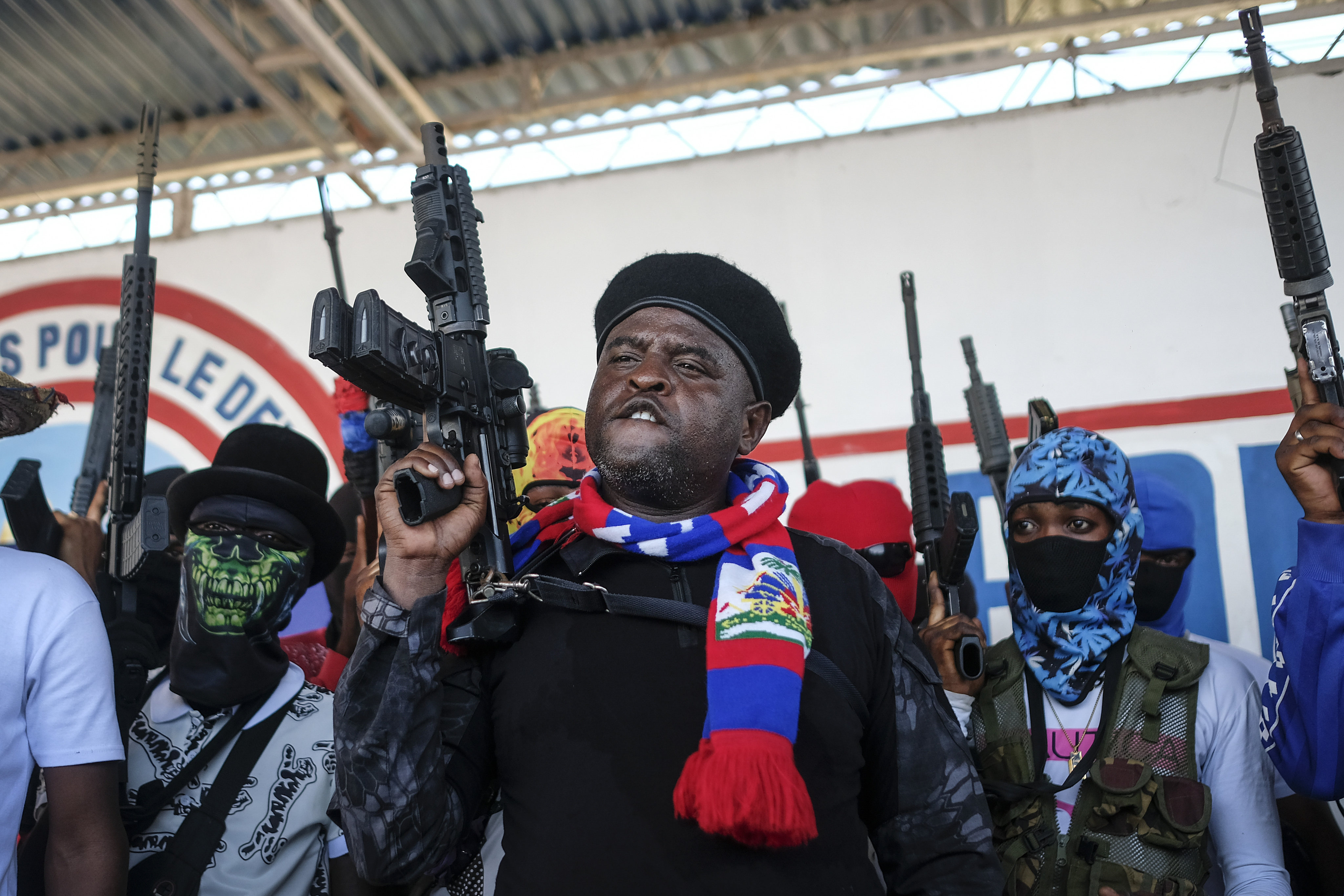 Gang leader Jimmy Cherizier, better known as Barbecue, shouts slogans with his gang members after giving a speech in Port-au-Prince, Haiti, in October 2021. File photo: AP
