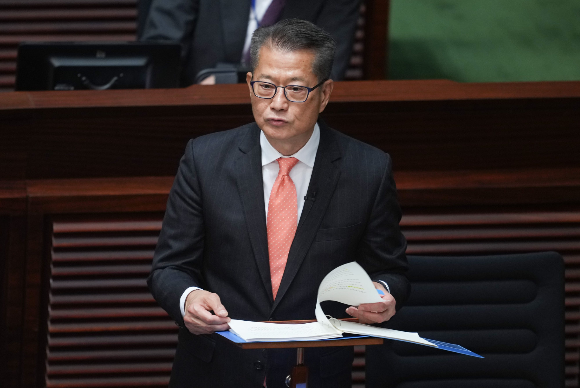 Paul Chan announcing his budget blueprint on Wednesday. The finance chief has said the reclamation project has been delayed “slightly” by two to three years. Photo: Sam Tsang