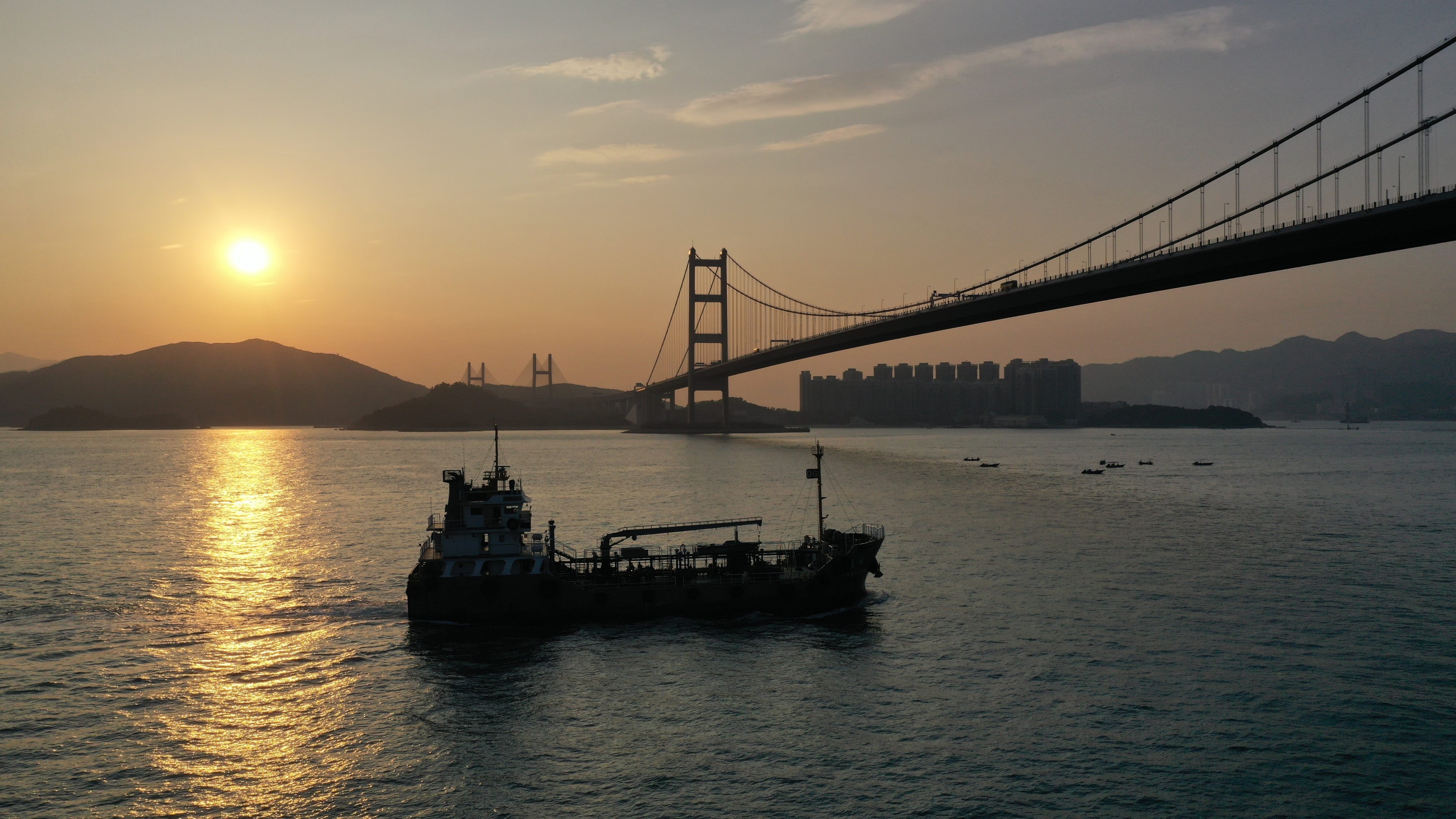 Vessels pass Hong Kong’s Tsing Ma Bridge. The city aims to establish a regional green fuel bunkering centre to make shipping more environmentally friendly. Photo: Martin Chan