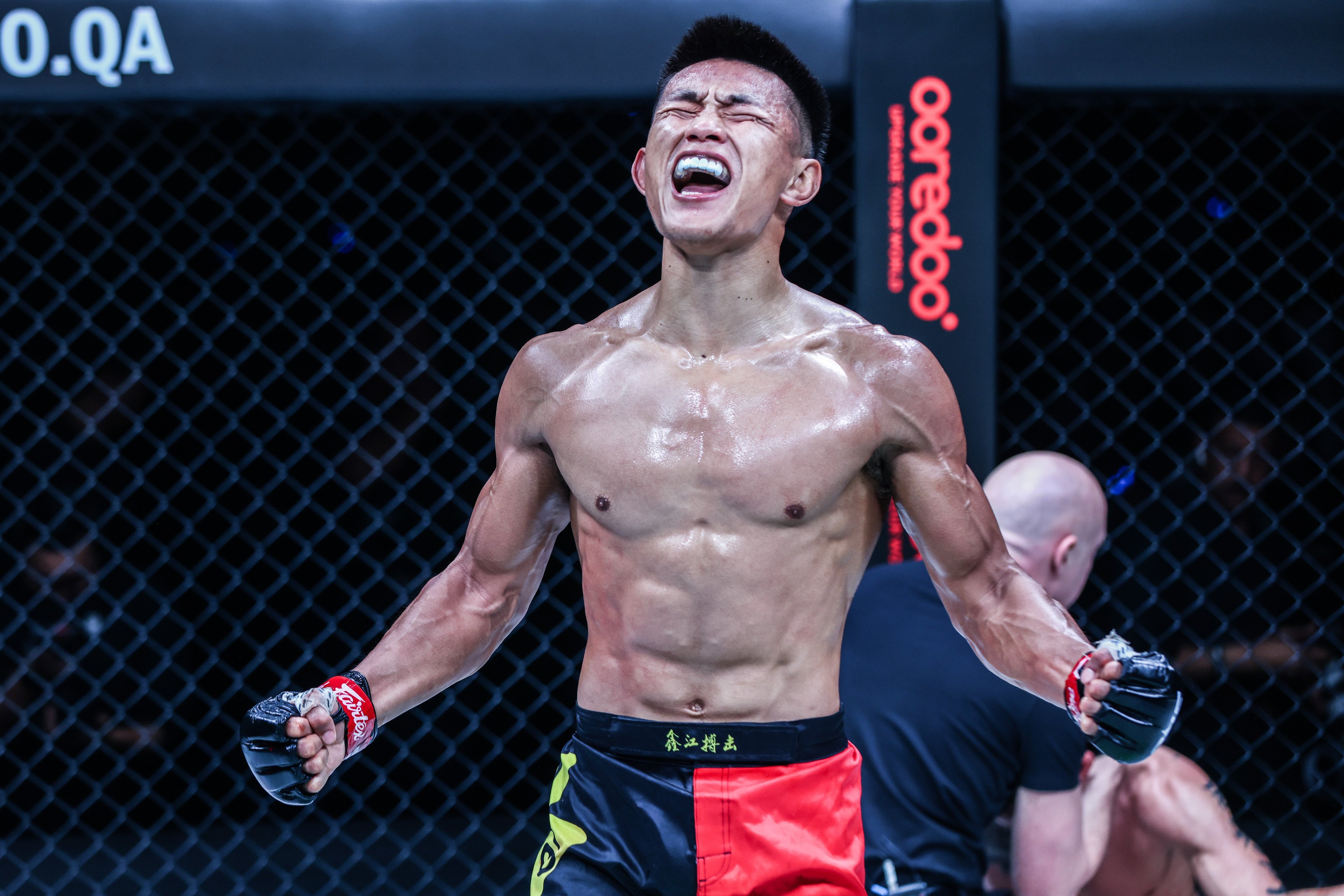 Tang Kai celebrates winning his featherweight title bout against Thanh Le at ONE 166 in Qatar. Photo: ONE Championship