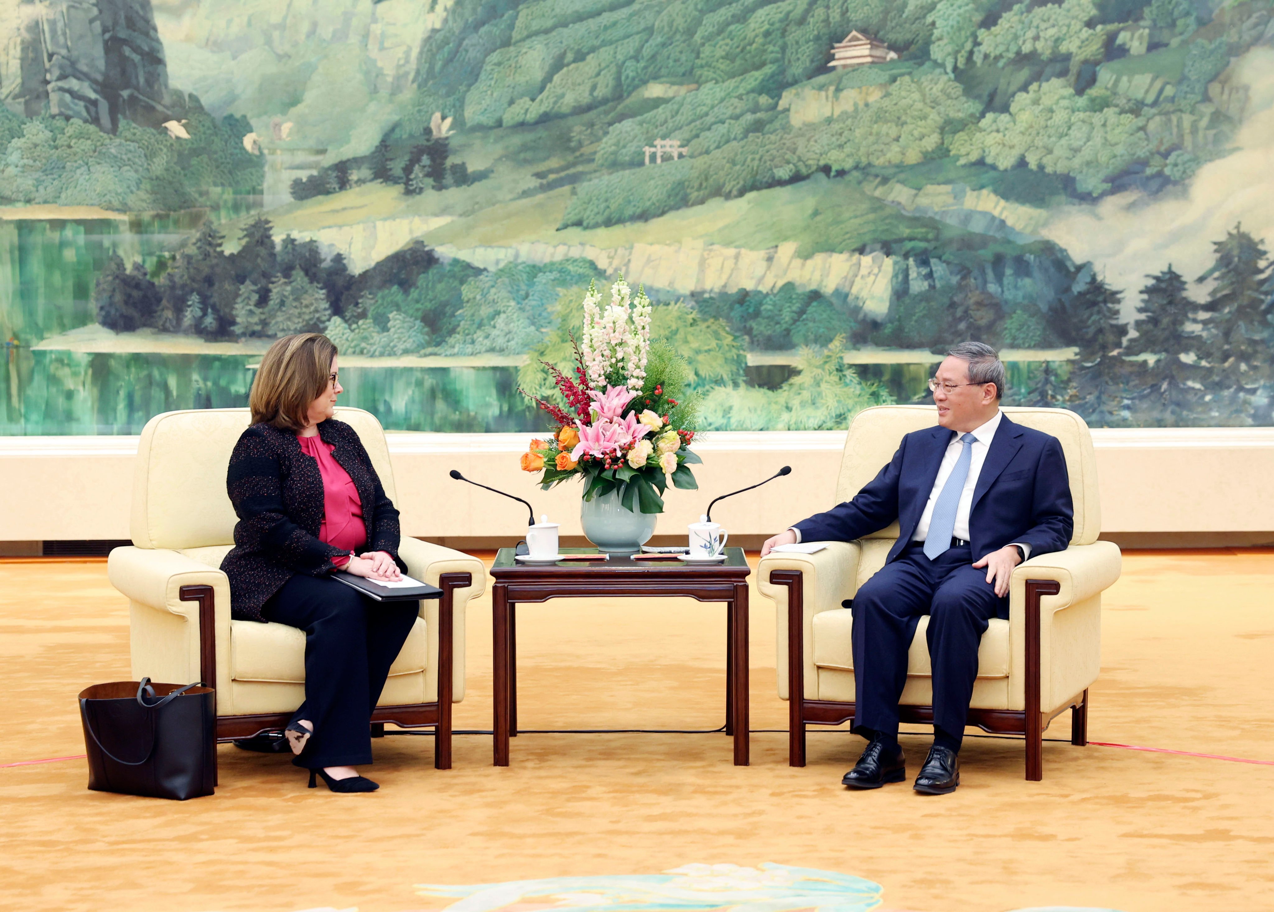 Chamber of Commerce chief executive Suzanne Clark and Chinese Premier Li Qiang at the Great Hall of the People in Beijing on Wednesday. Photo: Xinhua 