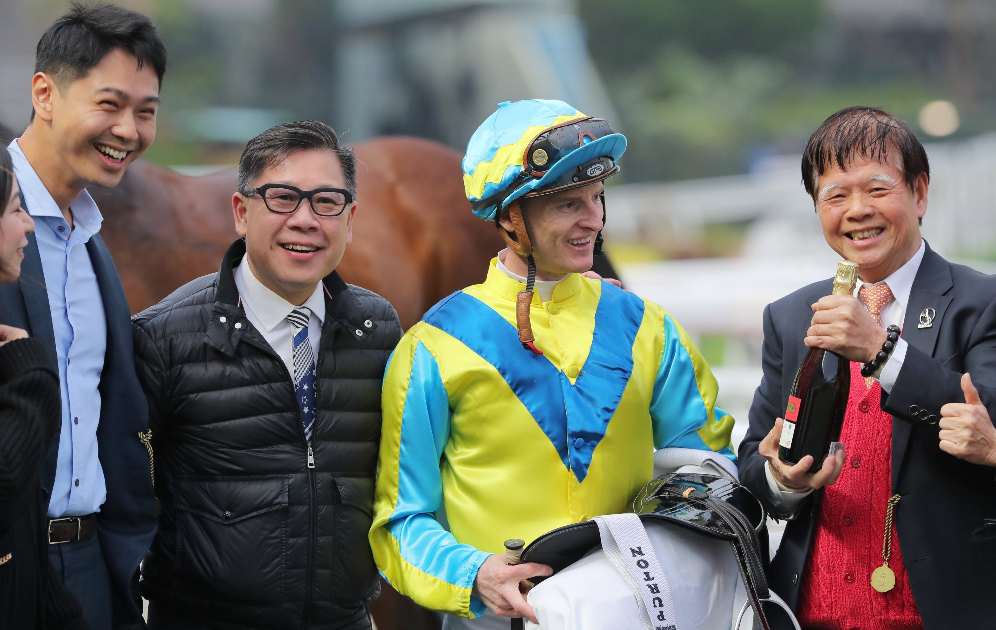 Trainer Dennis Yip and jockey Zac Purton enjoy Massive Sovereign’s victory with connections.