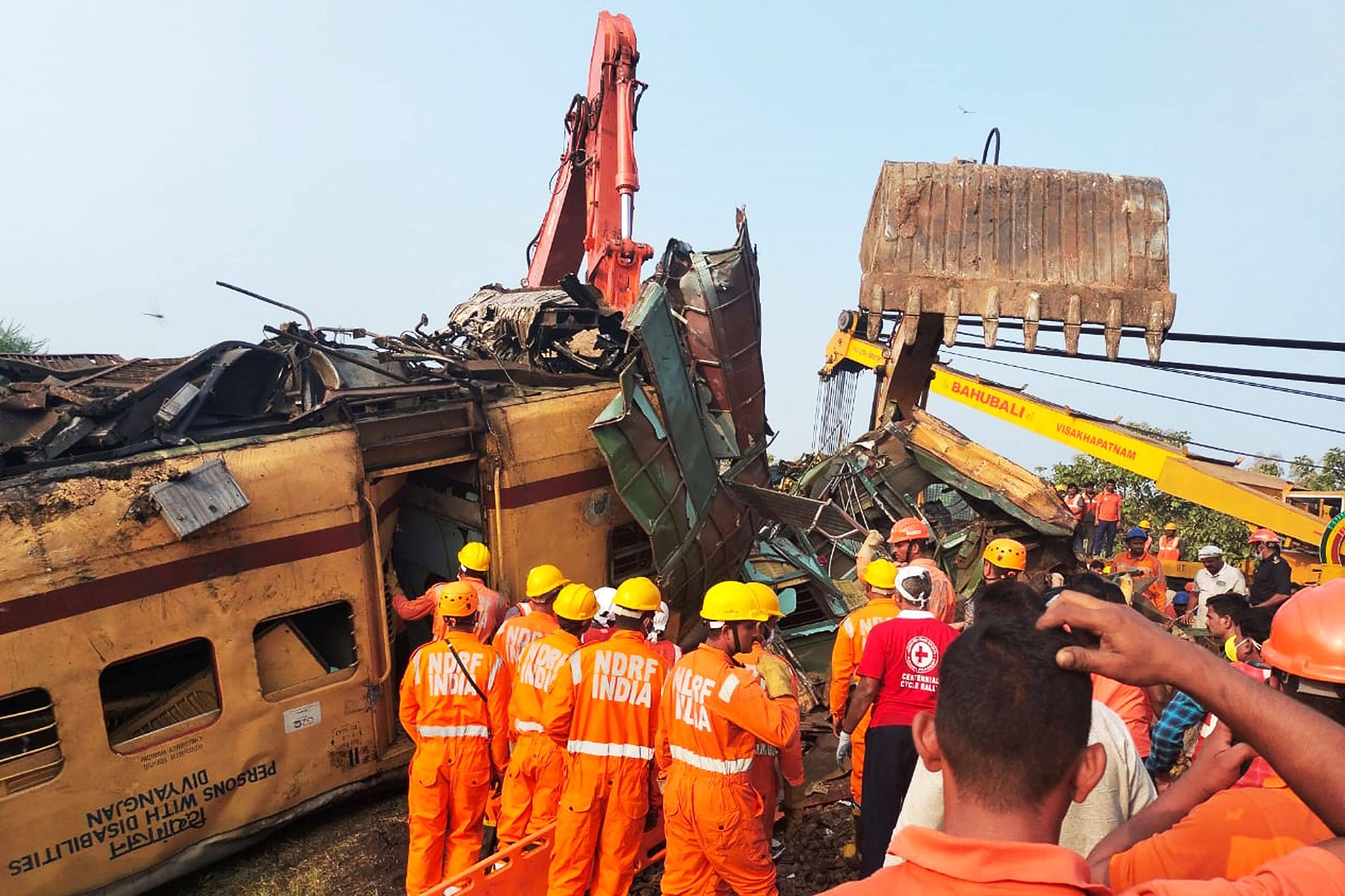 Rescuers from India’s National Disaster Response Force (NDRF) search the site of the fatal train crash in Vizianagaram district of India’s Andhra Pradesh on October 30 last year. Photo: AFP