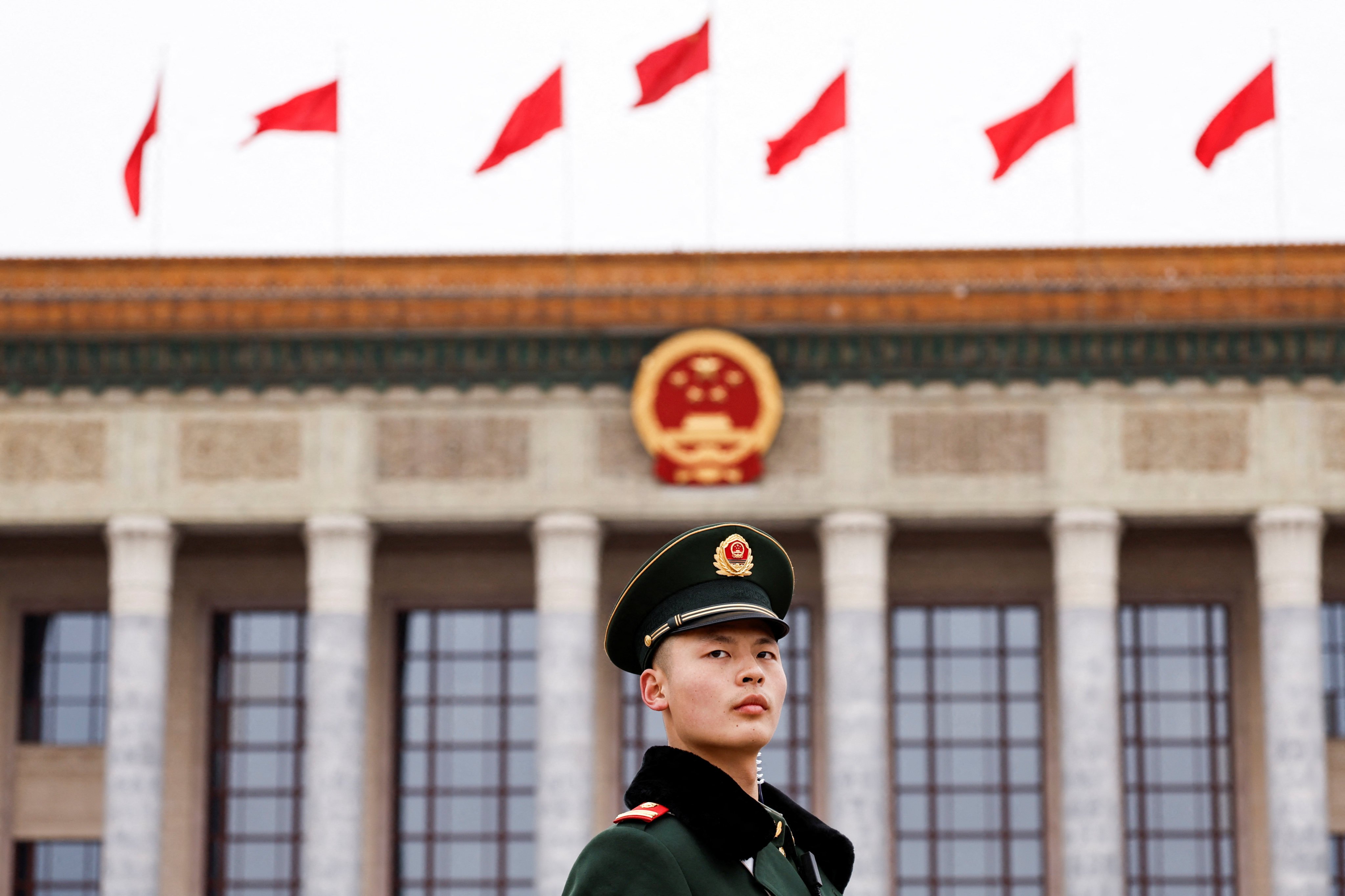 A paramilitary police officer stands guard on the day of the opening session of the Chinese People’s Political Consultative Conference in front of the Great Hall of the People in Beijing on Monday. Photo: Reuters