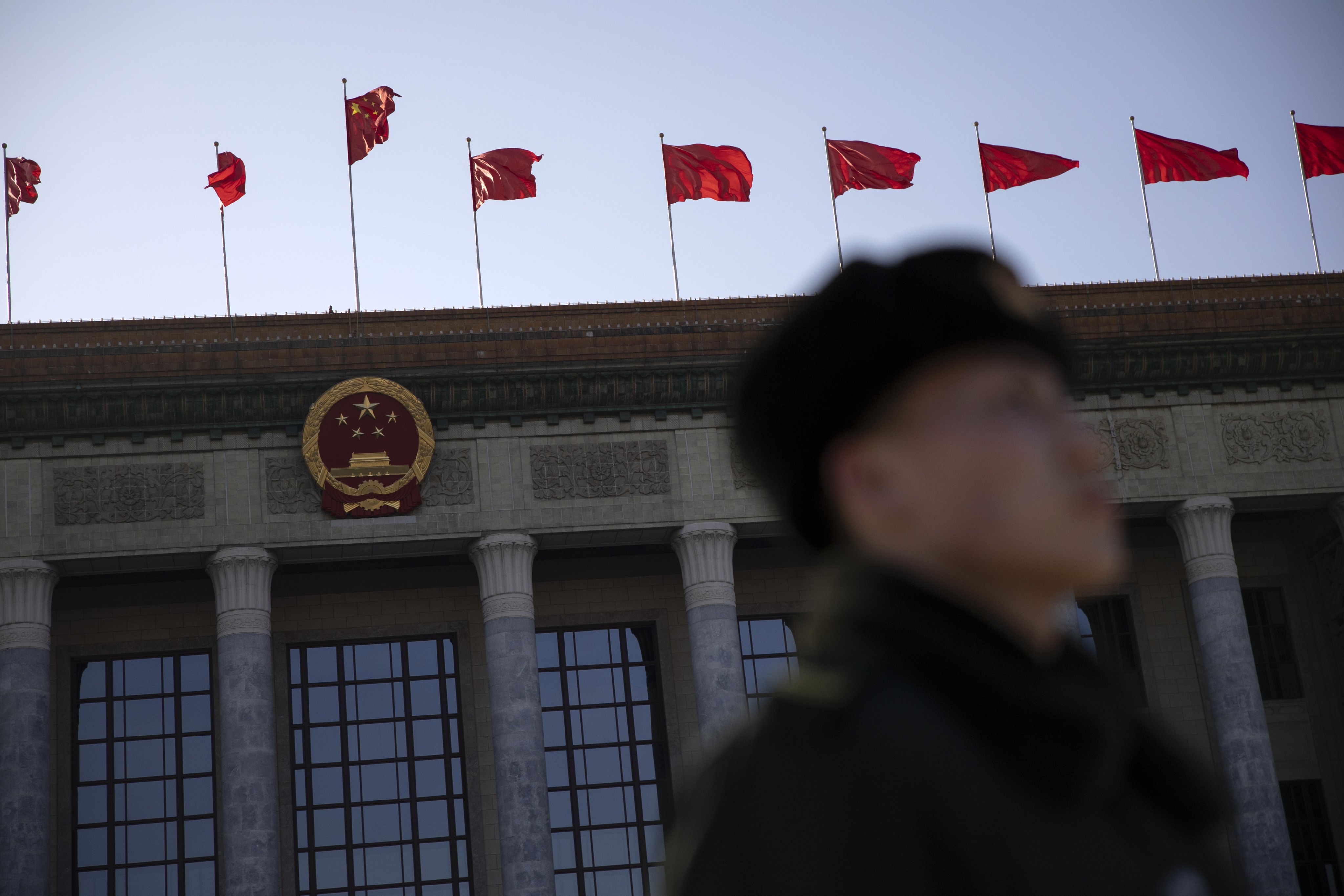 A Chinese soldier is seen outside the Great Hall of the People in Beijing on Sunday. Photo: EPA-EFE