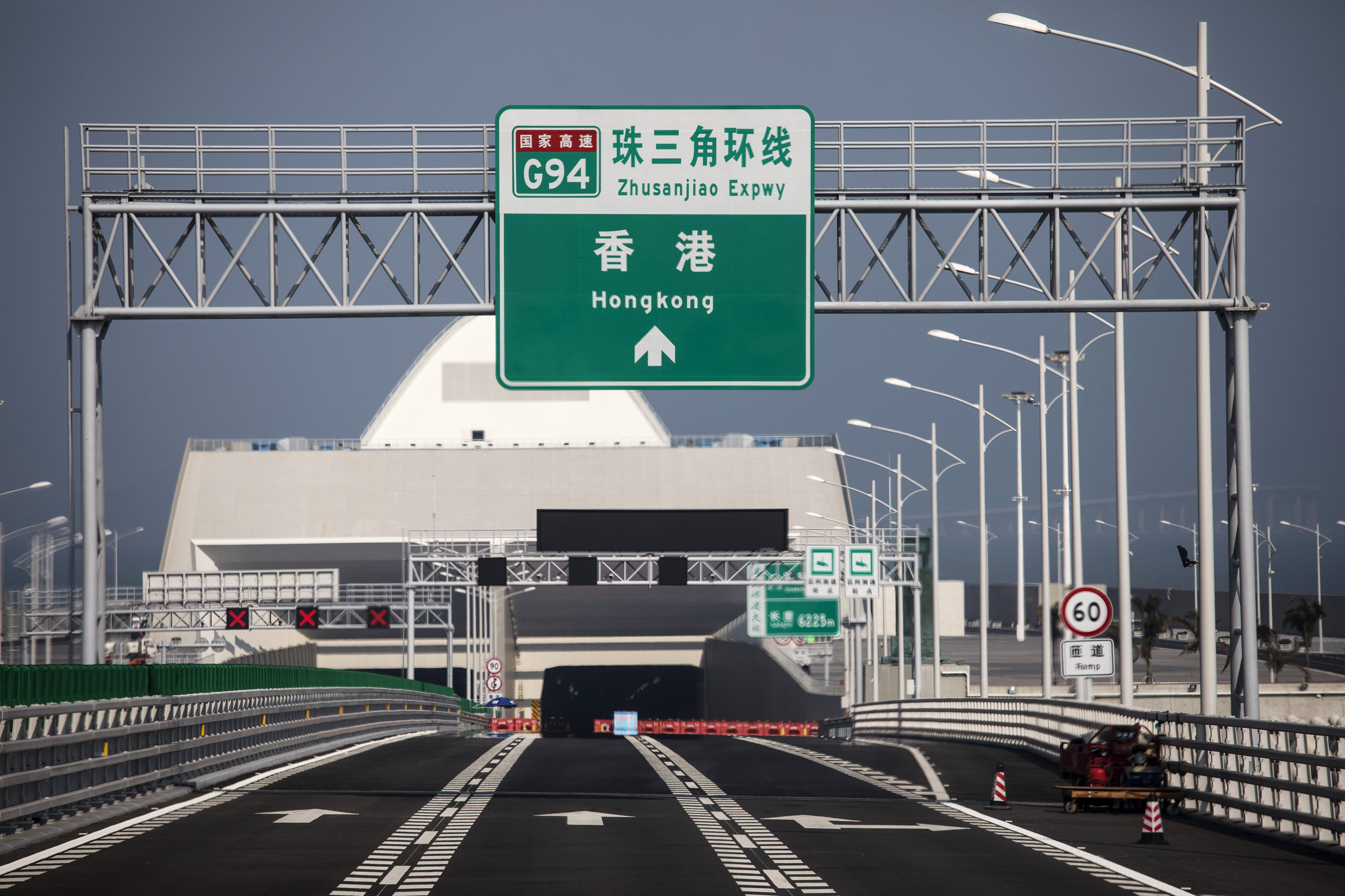 The sign pointing to Hong Kong at the tunnel on the western end of the Hong Kong-Zhuhai-Macau Bridge. Photo: Bloomberg