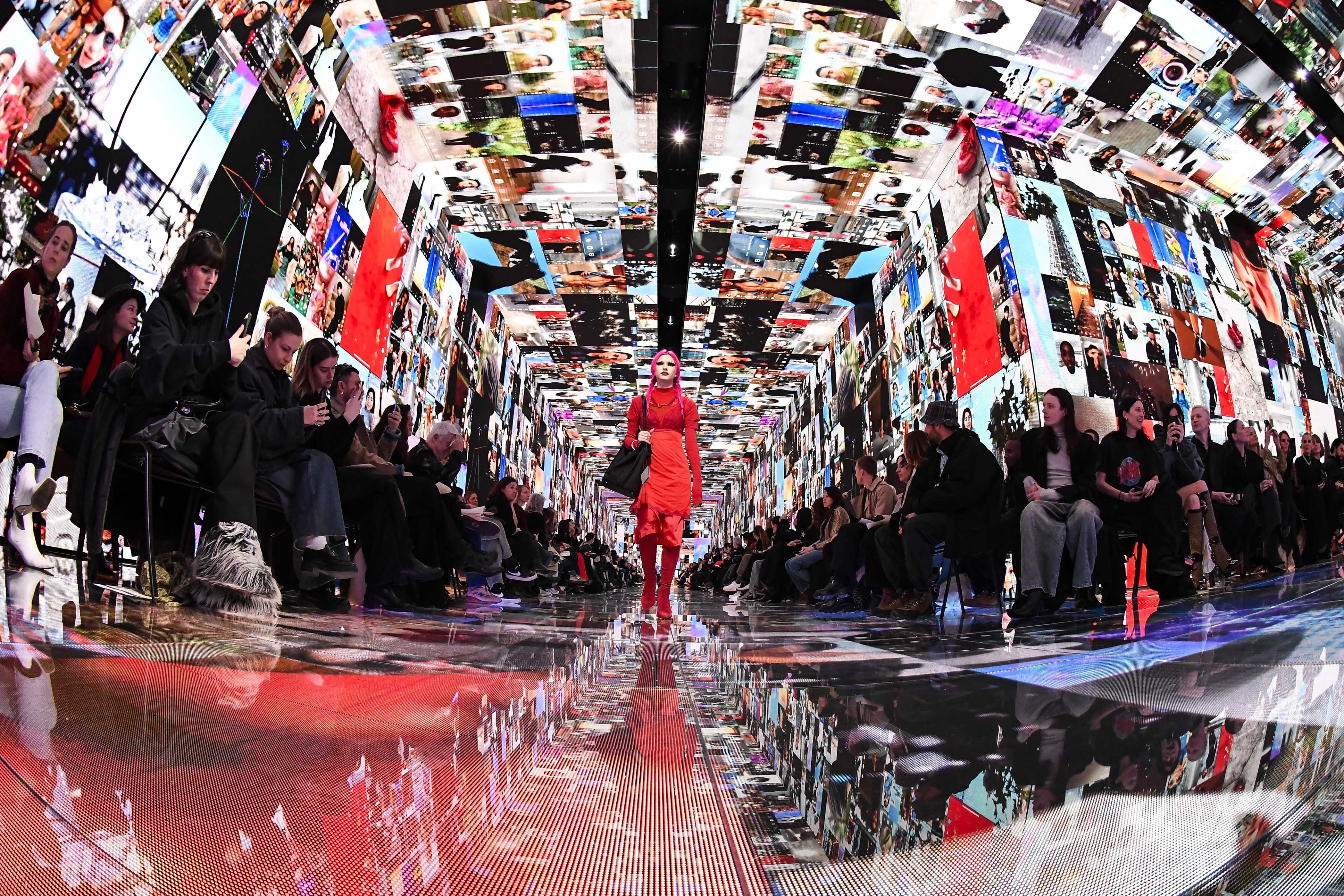 The Balenciaga winter 2024 show during Paris Fashion Week took place in a structure filled with screens playing videos of natural and electronic landscapes. Photo: Getty Images