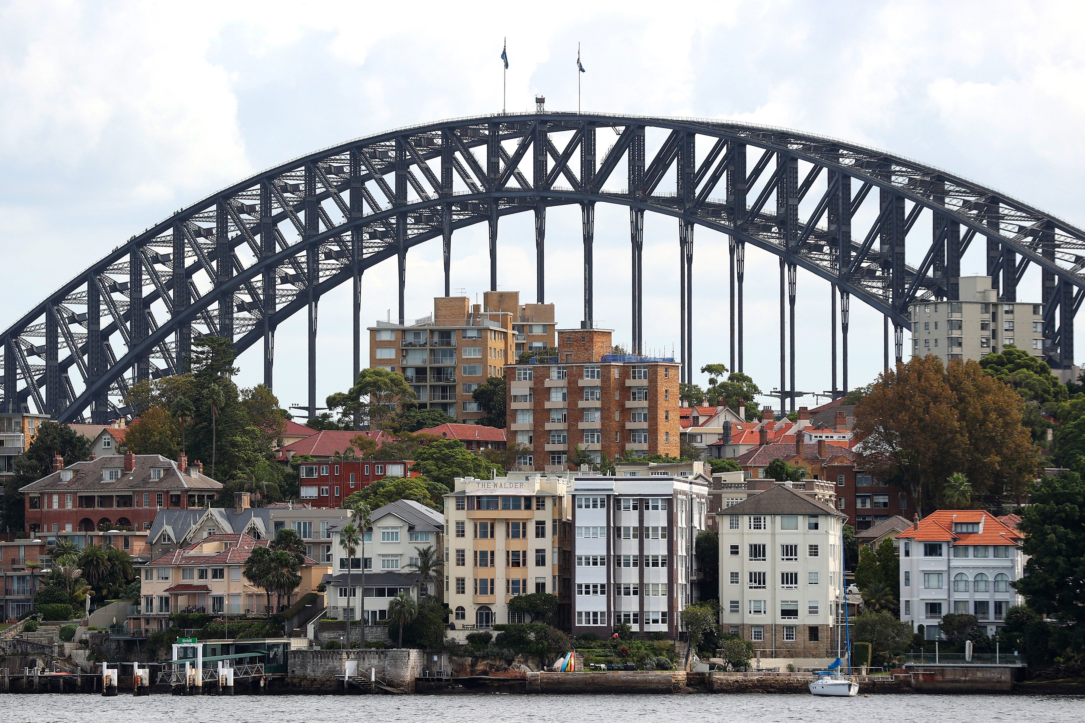 Residential buildings are seen in Sydney in March 2022. Australia’s housing market is increasingly unaffordable for first-time buyers and renters, but its appeal to foreign investors remains intact. Photo: Bloomberg