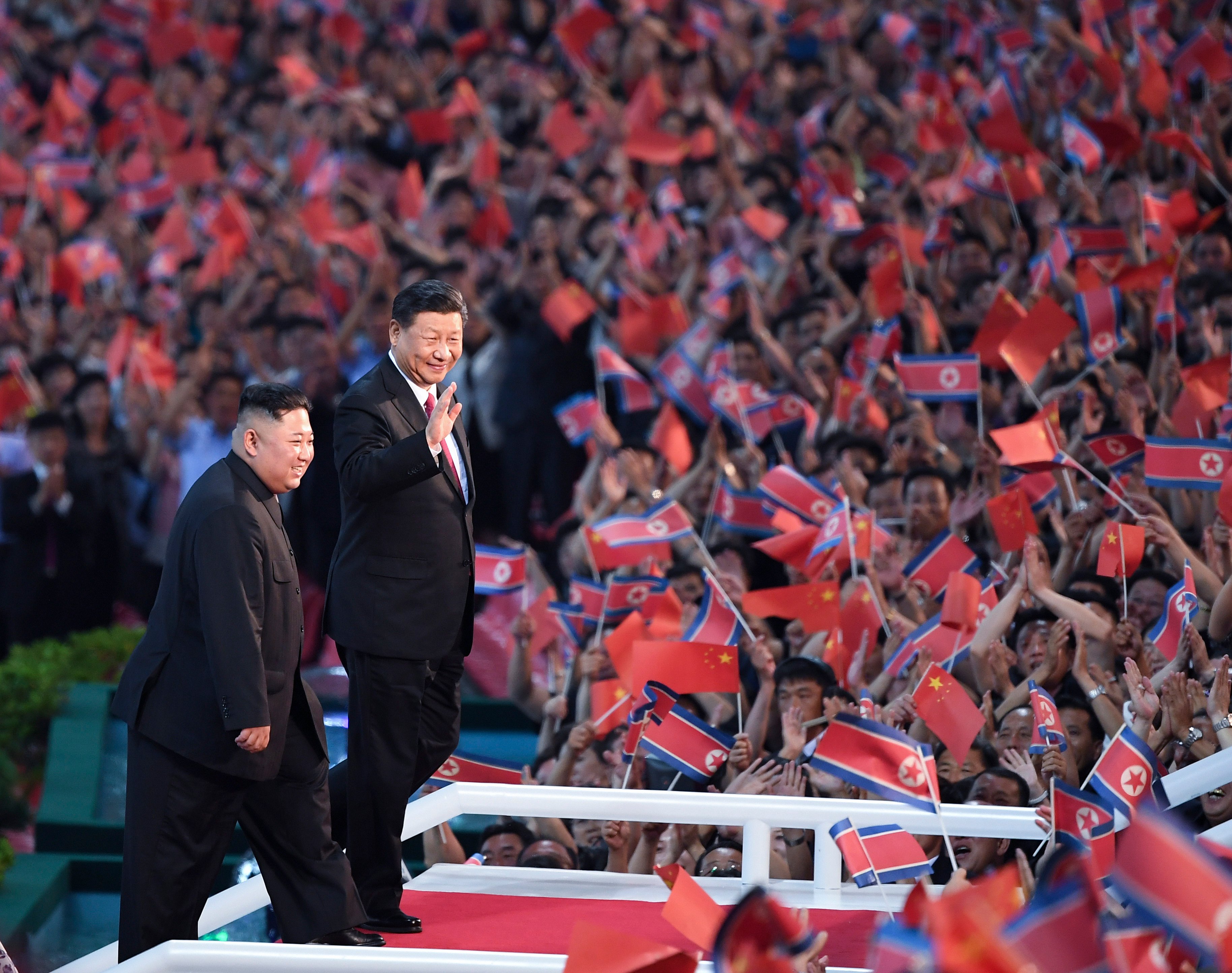 North Korean leader Kim Jong-un and Chinese President Xi Jinping attend a performance at the May Day Stadium in Pyongyang on June 20, 2019. This year marks the 75th anniversary of diplomatic relations between China and North Korea. Photo:  Xinhua