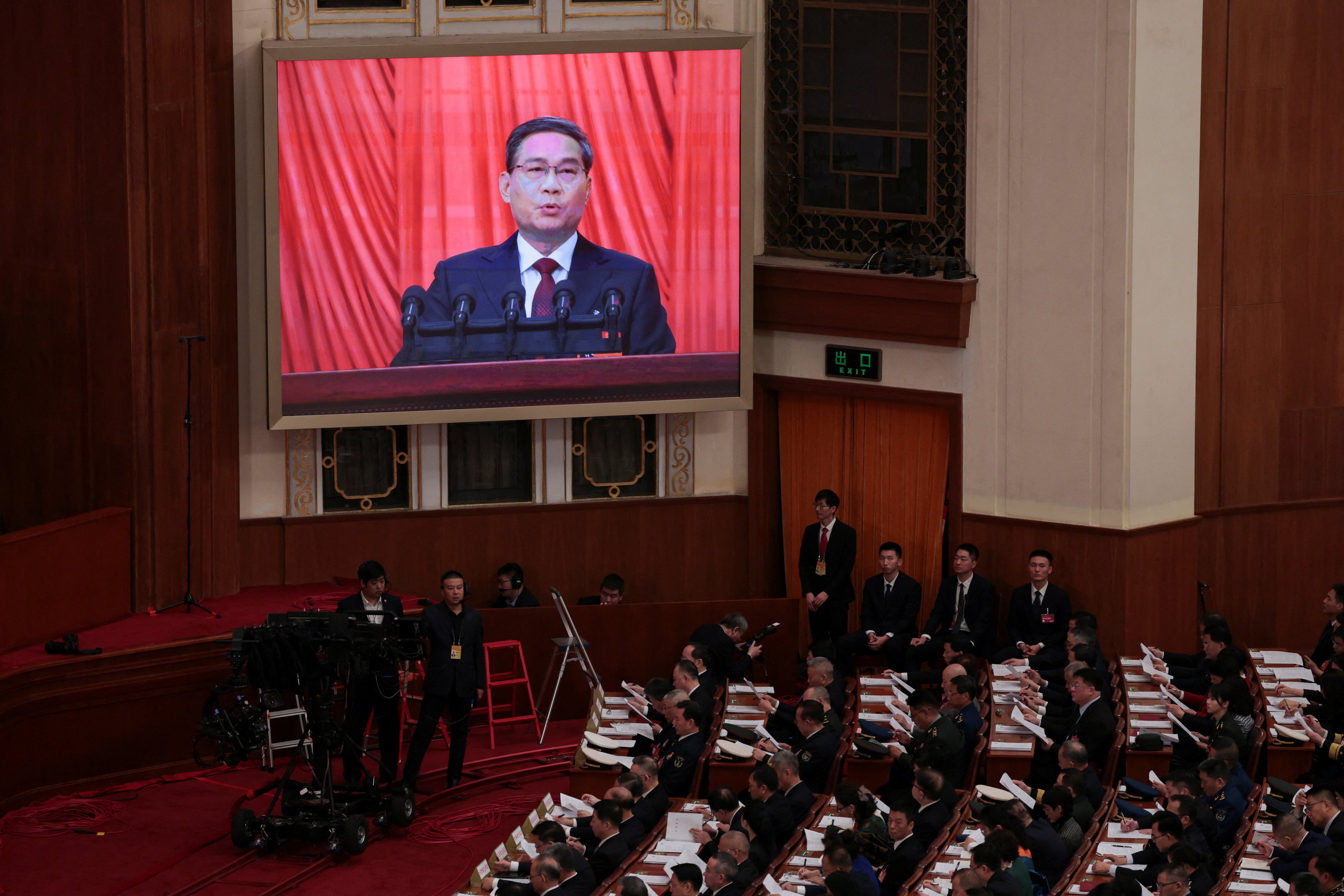 Chinese Premier Li Qiang addresses the opening session of the National People’s Congress at the Great Hall of the People in Beijing on Tuesday. Photo: Reuters