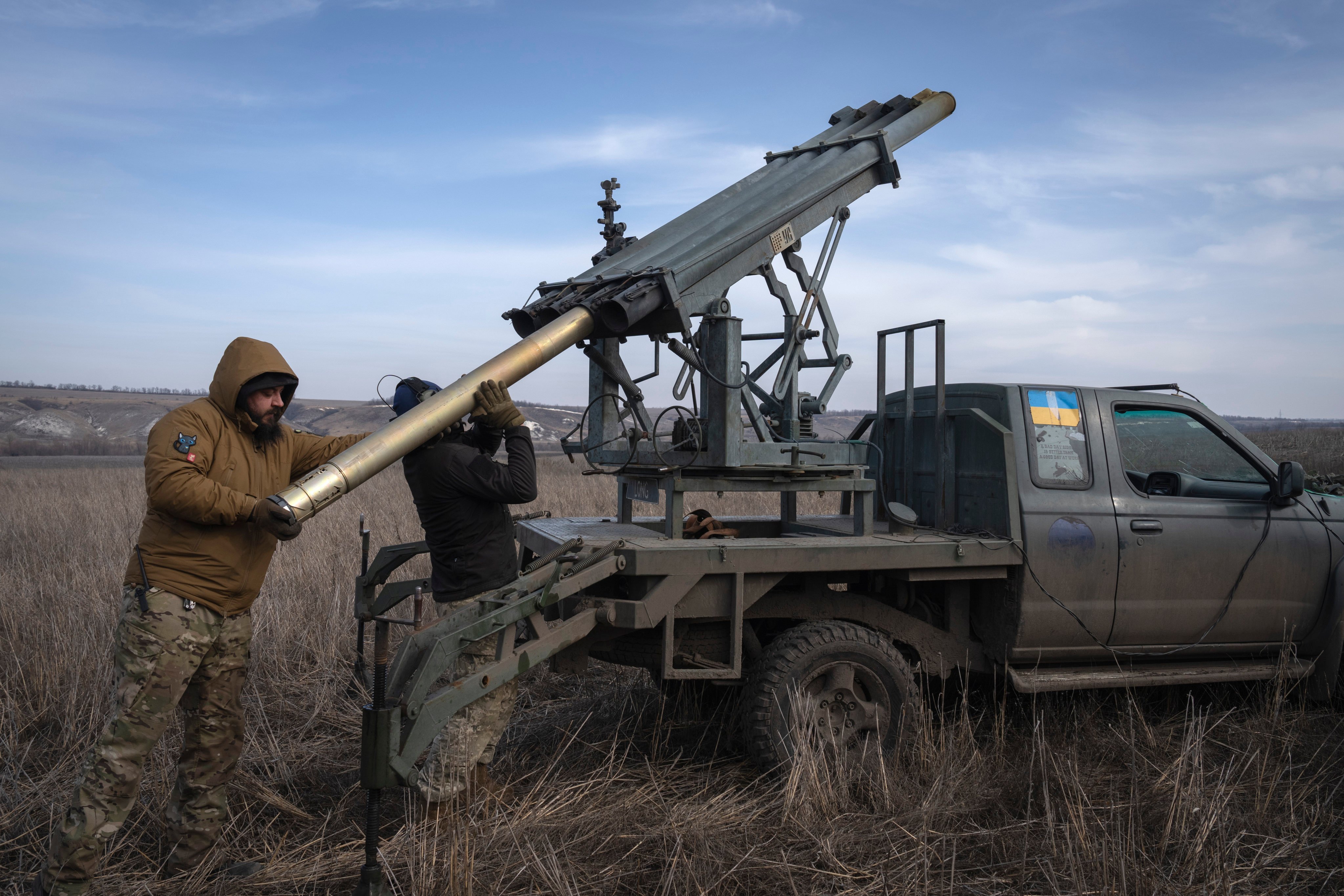 Ukrainian soldiers in Donetsk prepare to fire a multiple launch rocket system towards Russian positions on March 5. Photo: AP