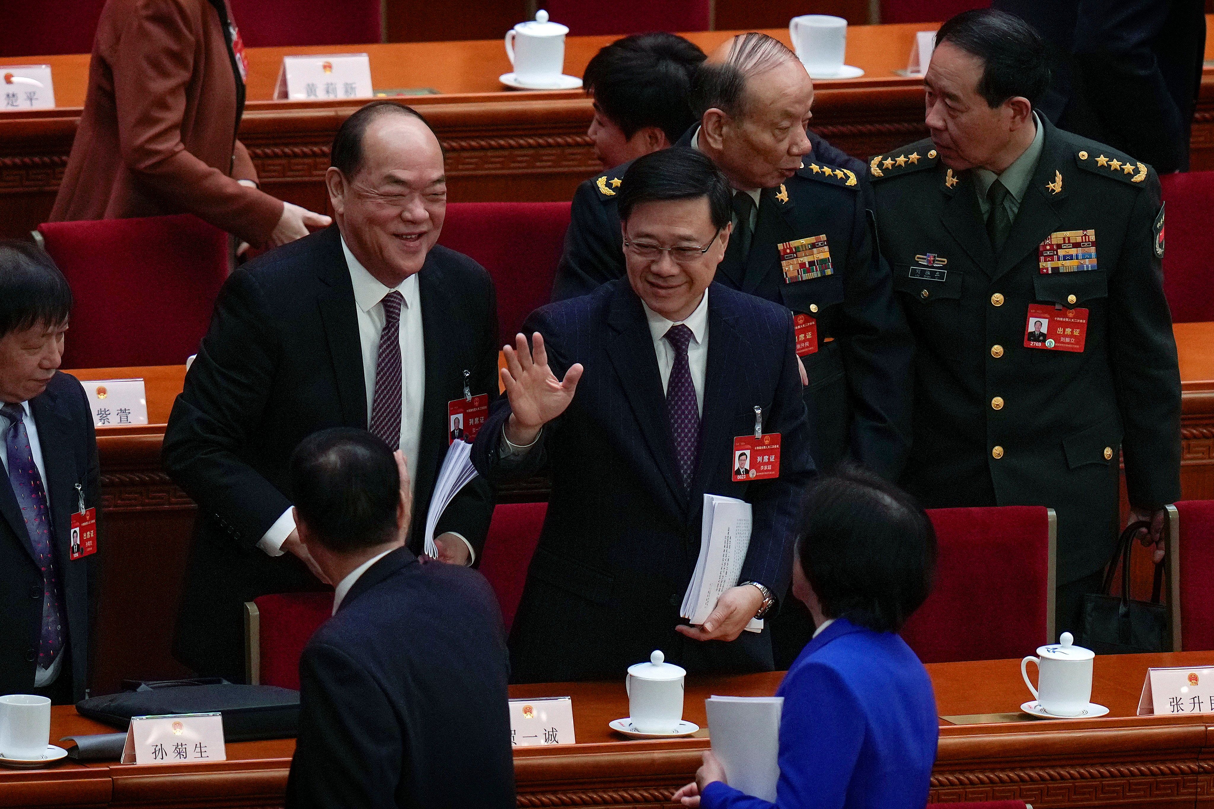 Chief Executive John Lee (centre) at the opening session of the National People’s Congress on Tuesday. He says public consultation will help “optimise” the proposed security law. Photo: AP