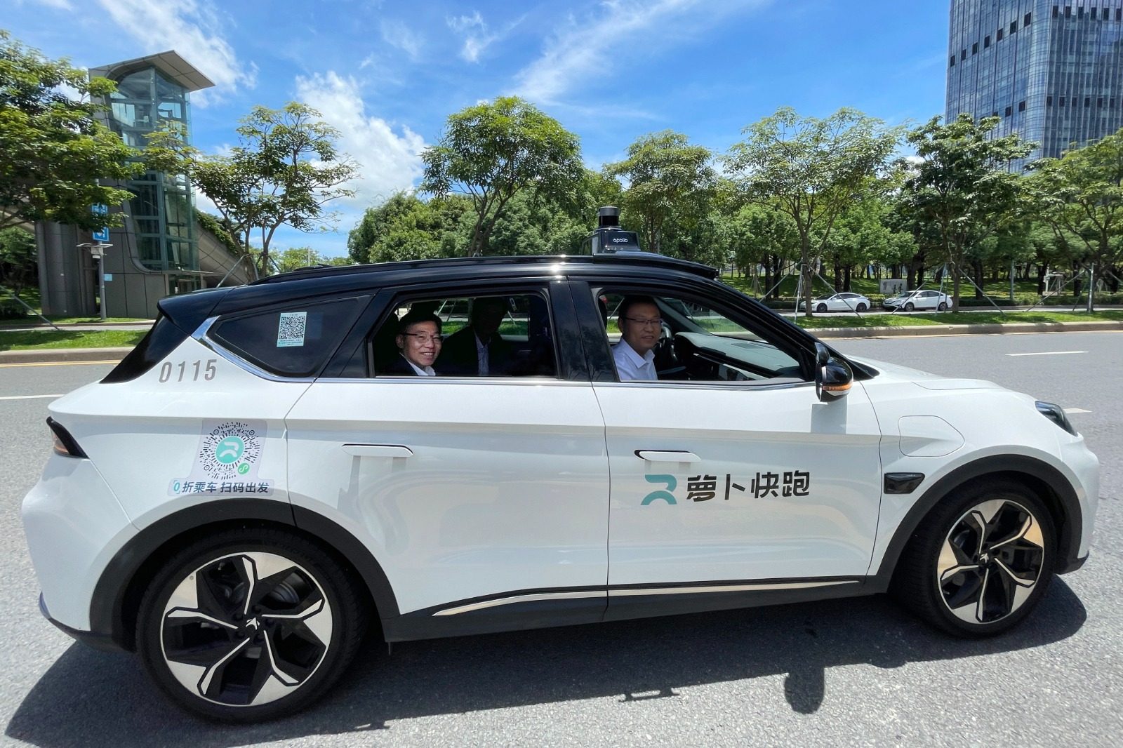 Secretary for Transport and Logistics Lam Sai-hung takes a ride in a self-driving car in Nanshan, Shenzhen, in July 2023. Photo: Information Services Department