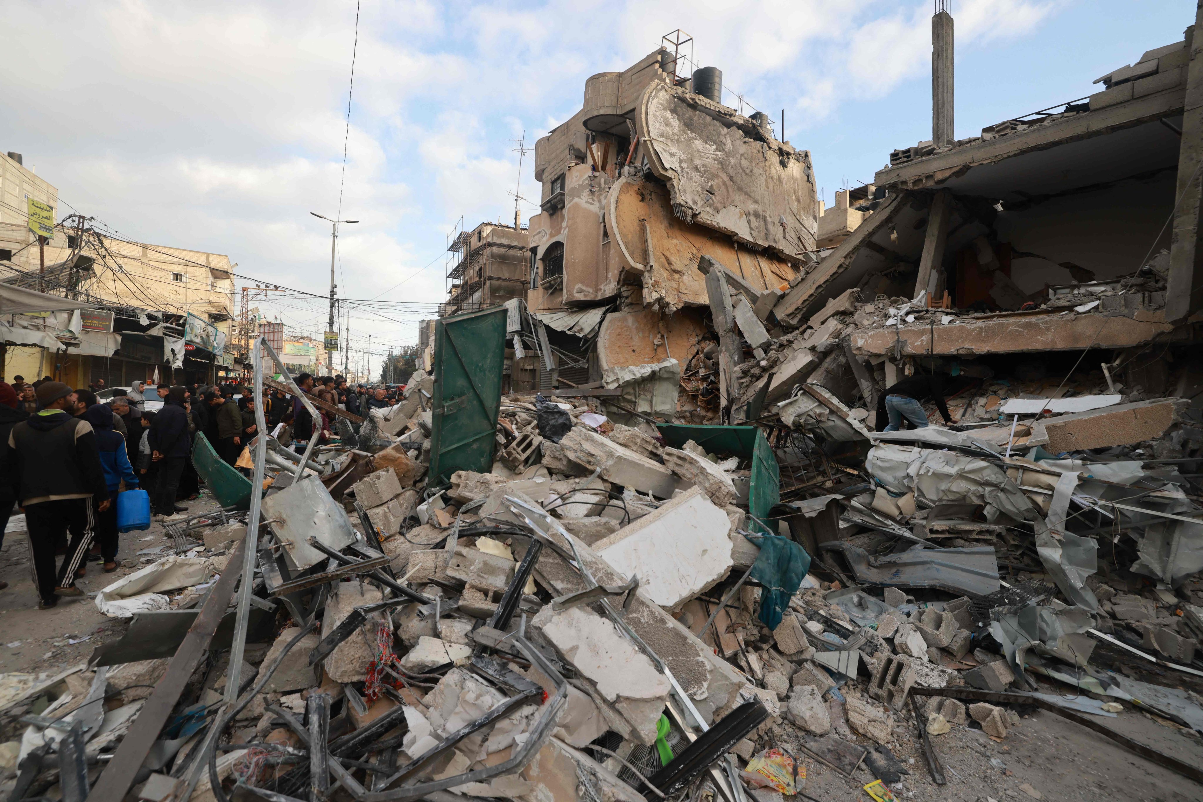 Palestinians inspect the debris of a house destroyed by Israeli bombing in Rafah in the southern Gaza Strip. Photo: AFP