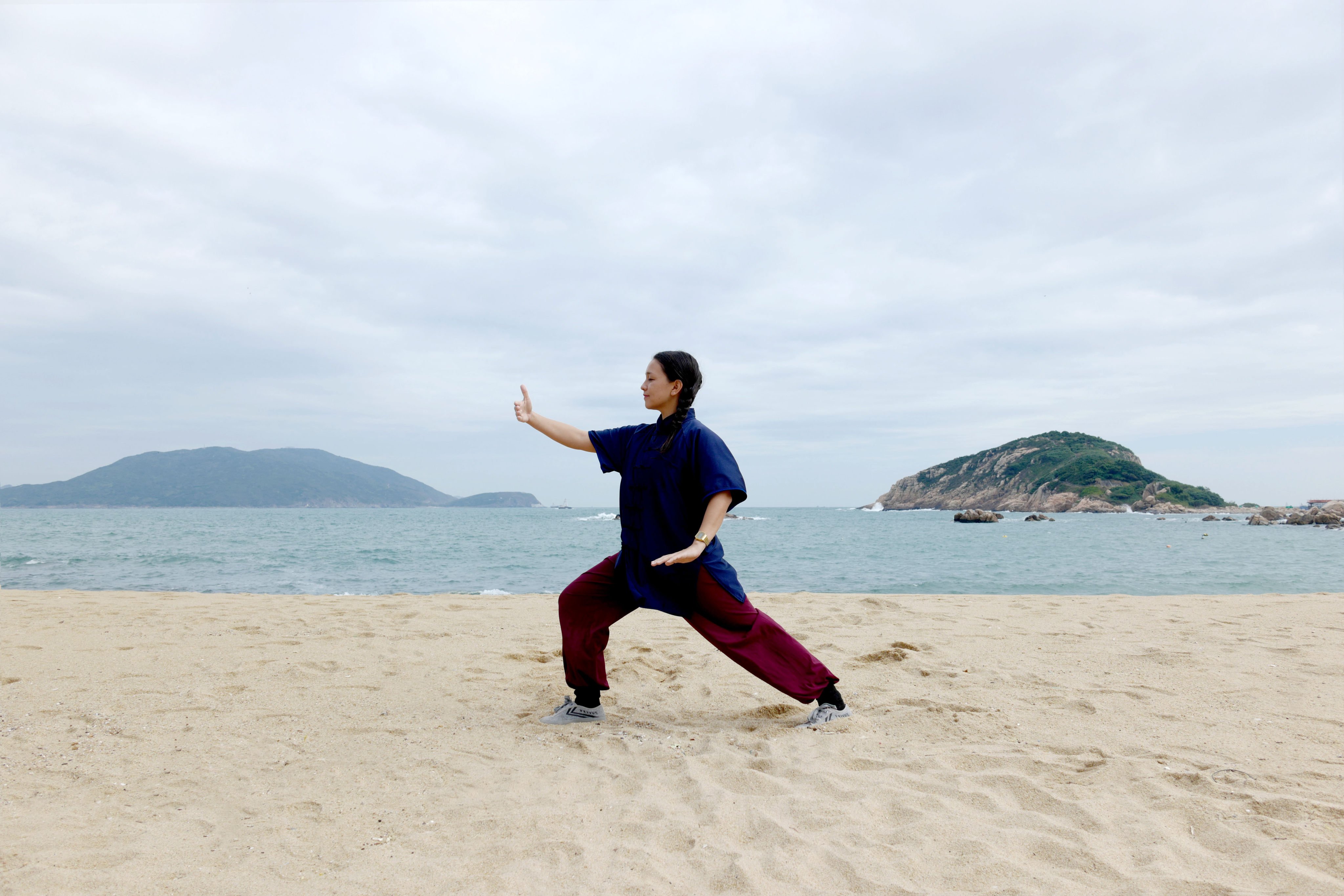 Sara Chung practises tai chi at a beach in Shek O in Hong Kong. A study suggests that this ancient Chinese martial art may help lower blood pressure in people at risk of developing hypertension more effectively than conventional aerobic exercise. Photo: Sara Chung
