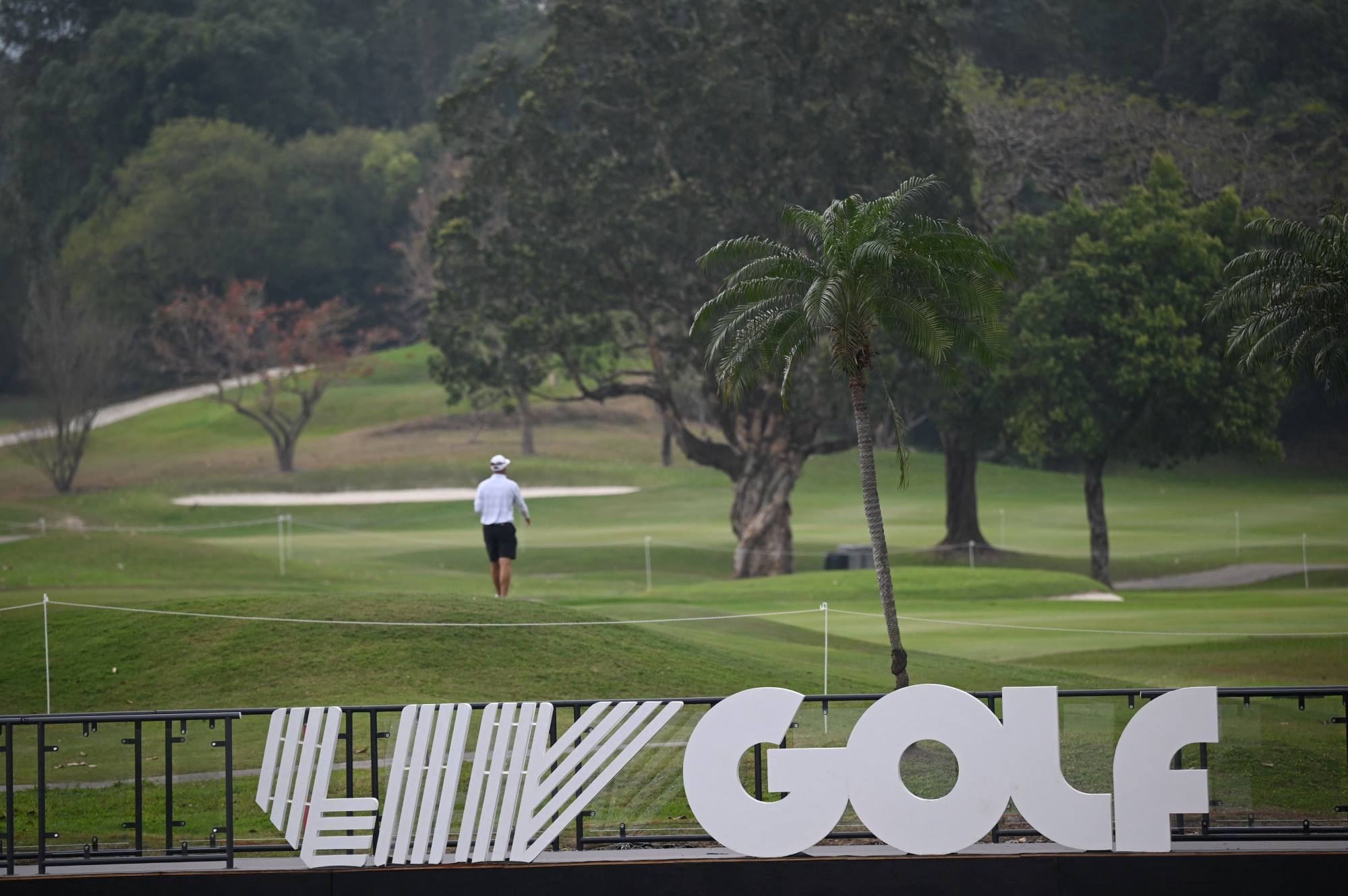 A visitor walks on the course ahead of the LIV Golf tournament at Fanling. Photo: AFP