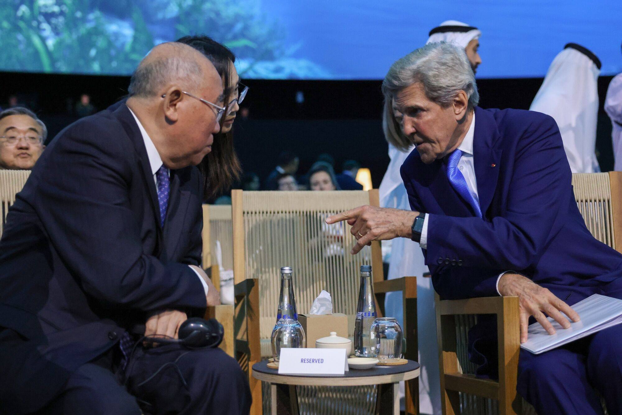 Xie Zhenhua, China’s special envoy for climate change, and John Kerry, US special presidential envoy for climate, speak at the COP28 conference in Dubai on December 2. Photo: Bloomberg