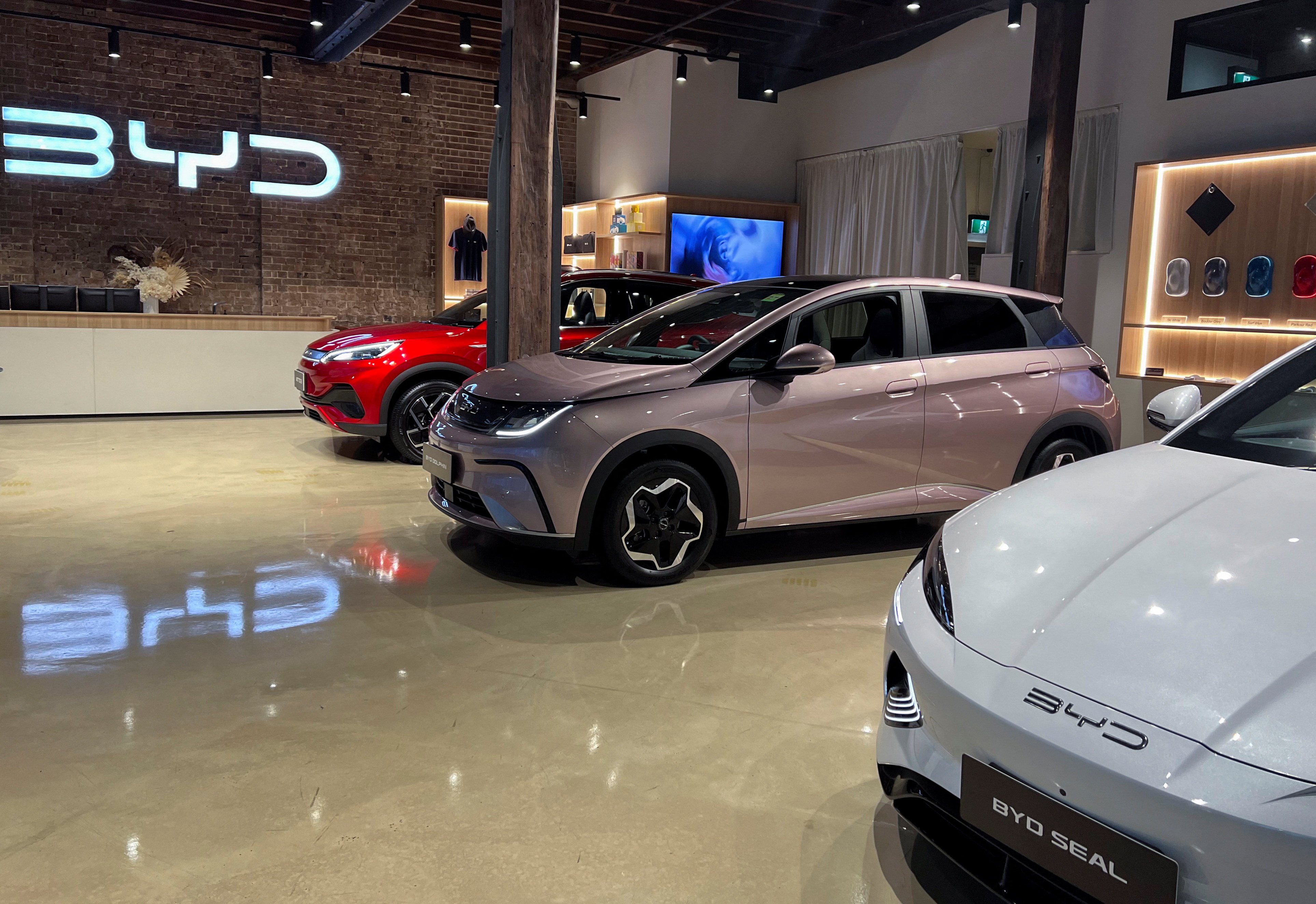 BYD Atto 3 SUV and BYD Dolphin hatchback displayed at the company’s experience centre in Sydney. Photo: Reuters