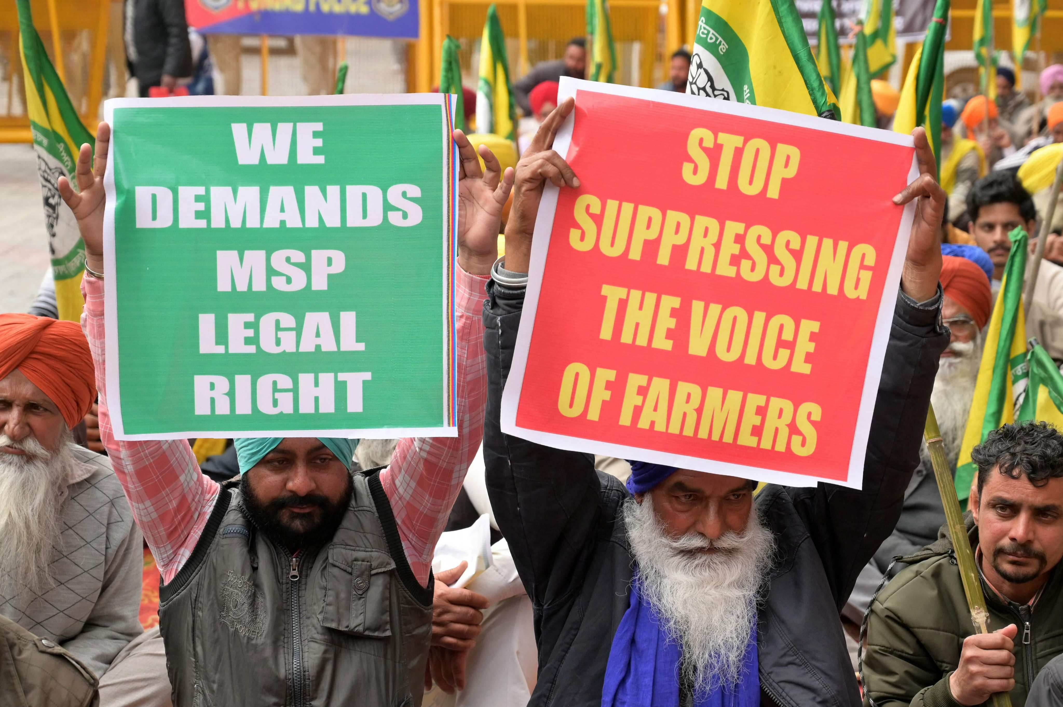 Farmers hold placards and shout slogans during a protest against India’s central government to demand minimum crop prices in Amritsar on Tuesday. Photo: AFP