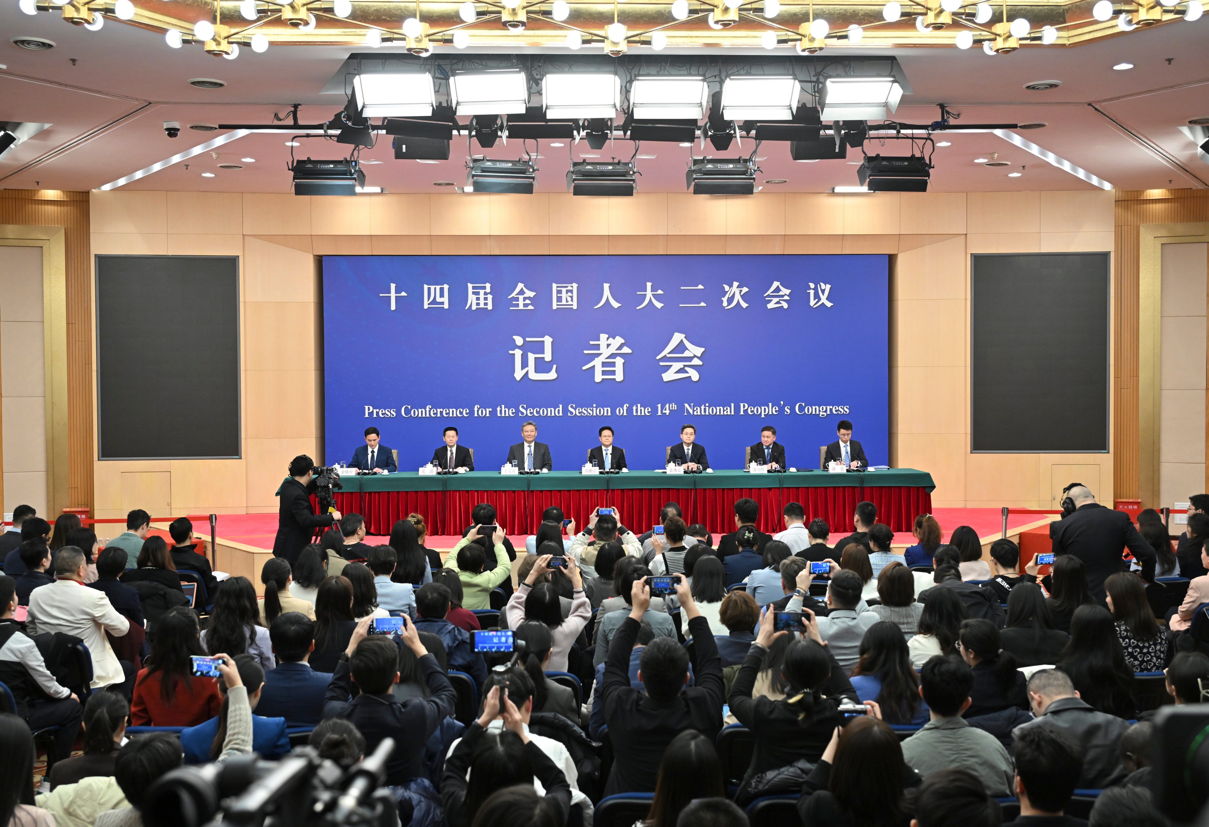 China’s finance, commerce, banking, development and securities heads face the press in Beijing during the annual “two sessions”. Photo: Xinhua
