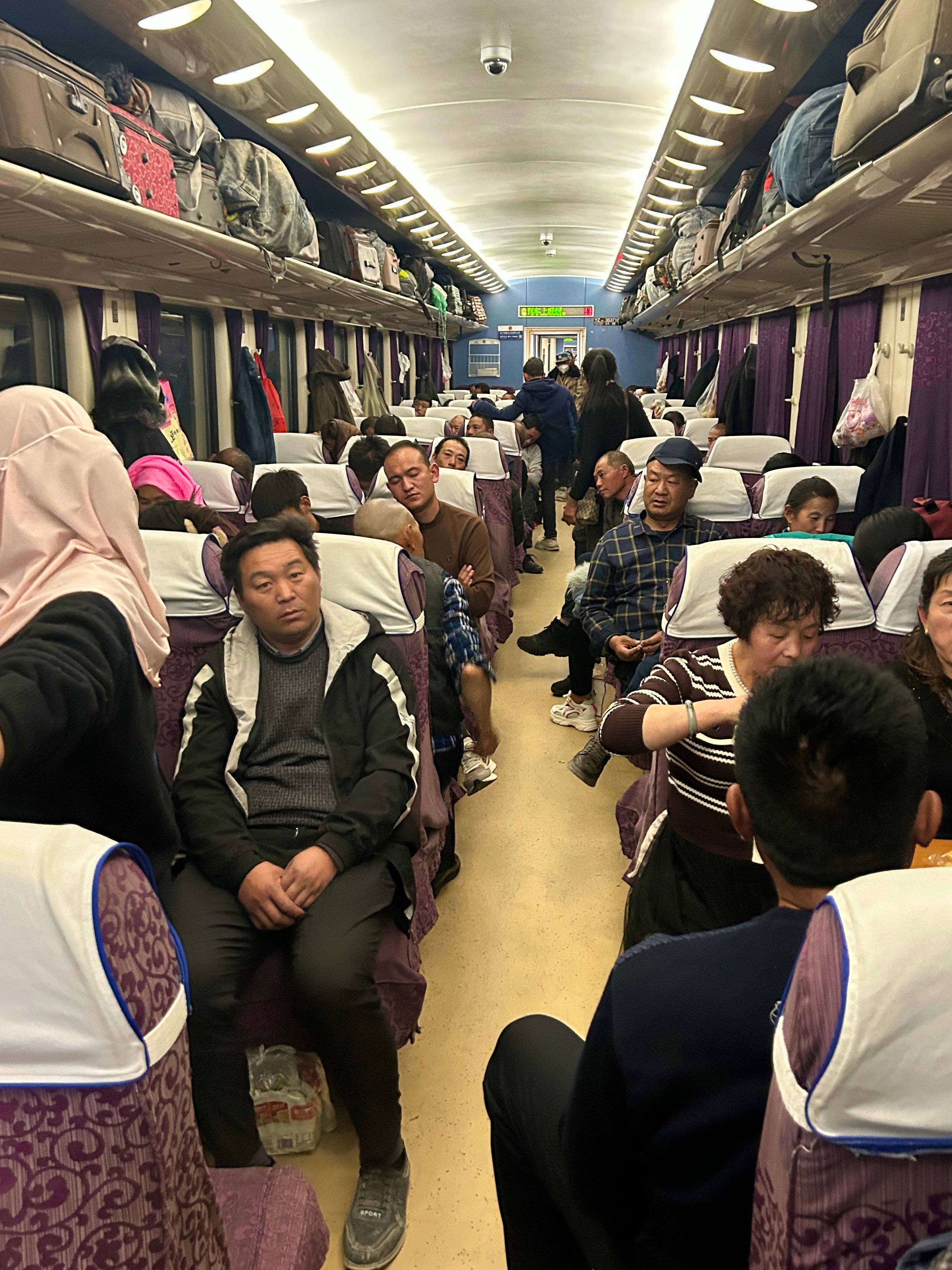 Passengers on a Chinese overnight train travelling from Lhasa, in Tibet, to Chengdu, in Sichuan province. Photo: Ian Neubauer