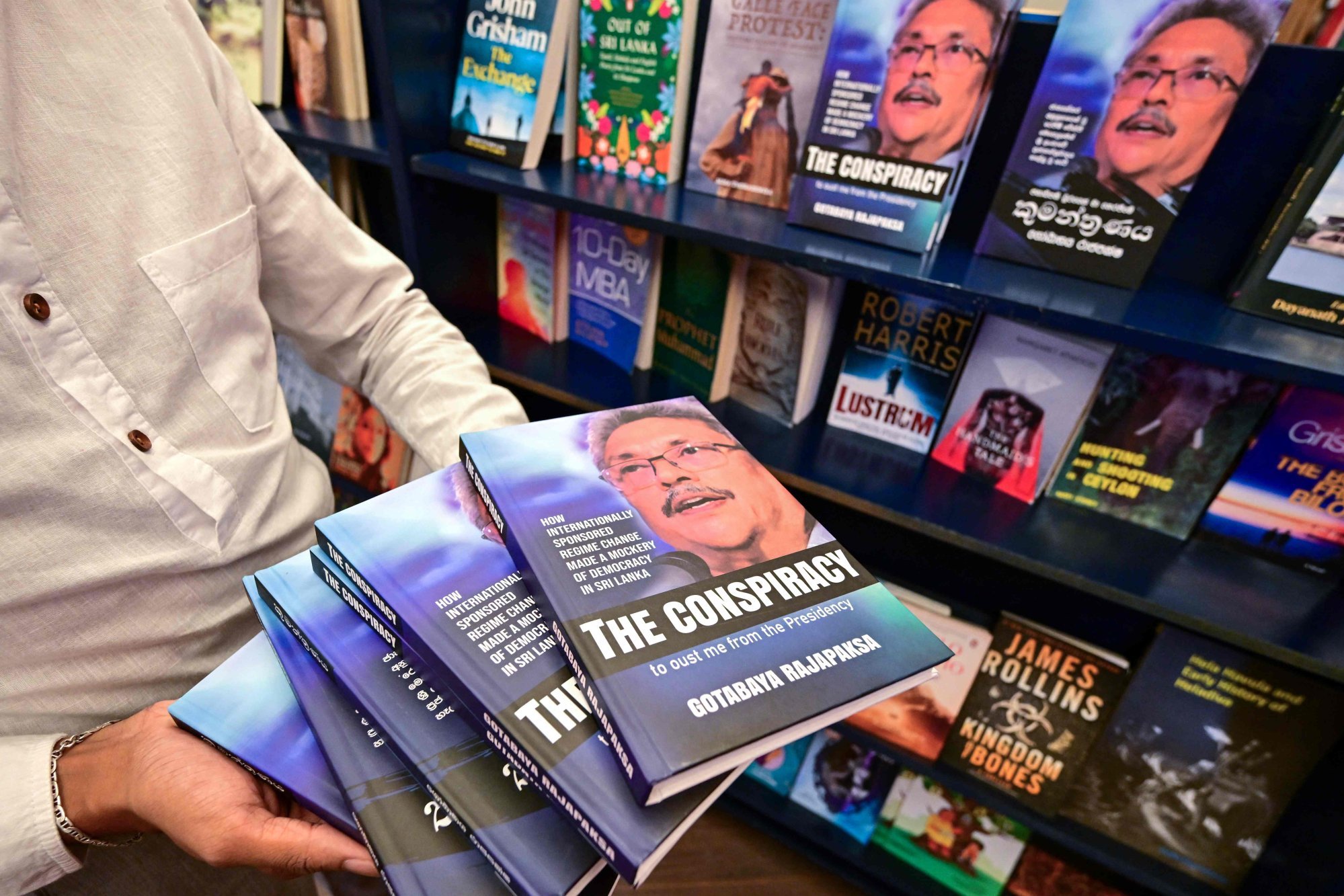 Copies of the book ‘The Conspiracy’ written by toppled Sri Lankan president Gotabaya Rajapaksa at a bookshop in Colombo. Photo: AFP