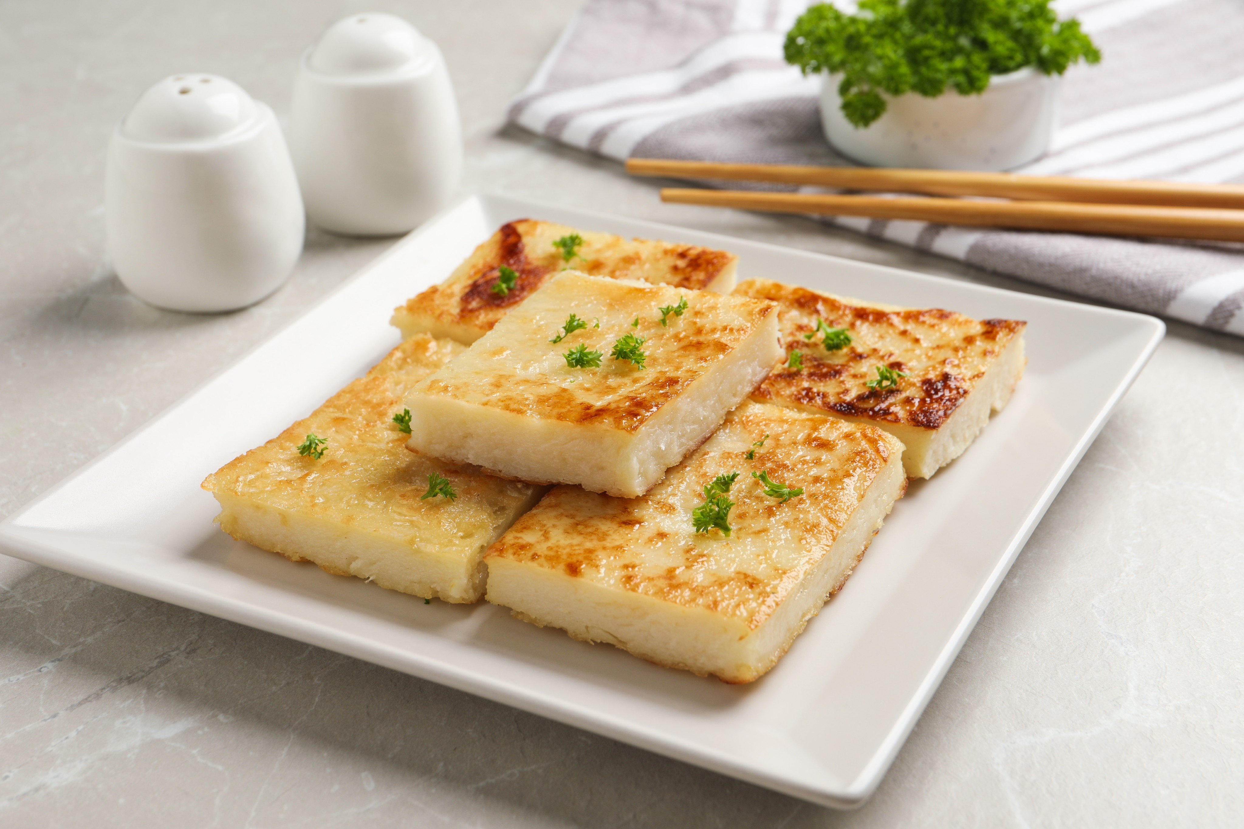 Most Hongkongers will say lo bak gou, or turnip cake, is a must-try dish for any authentic dim sum experience, but pan-fried versions can be too oily. Photo: Shutterstock