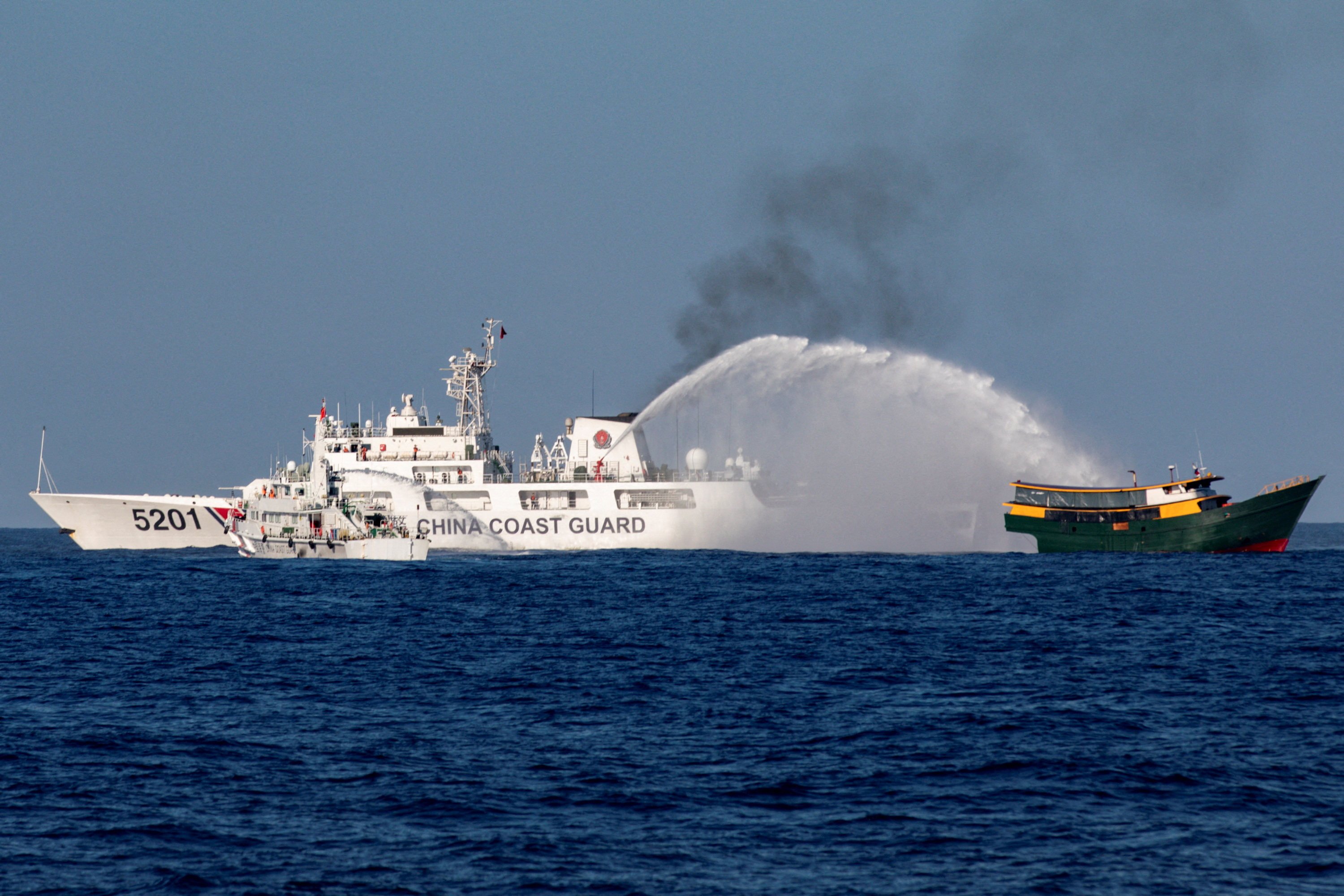 China Coast Guard vessels fire water cannons towards a Philippine resupply vessel on its way to a resupply mission at Second Thomas Shoal in the South China Sea on March 5. Photo: Reuters