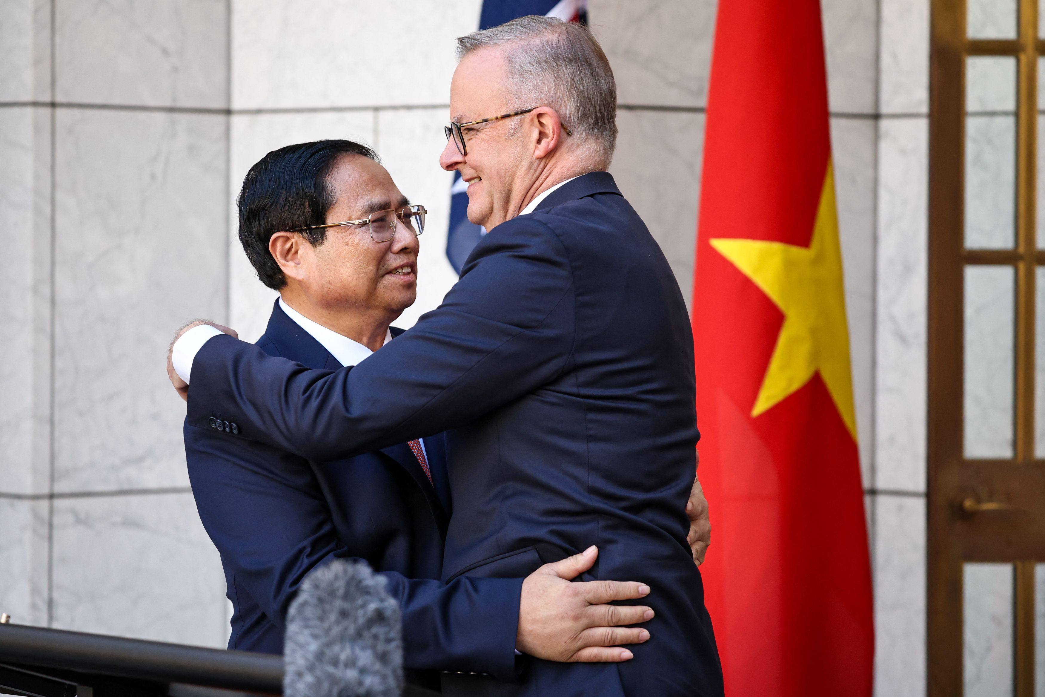 Vietnam Prime Minister Pham Minh Chinh (left) embraces his Australian counterpart Anthony Albanese after delivering a joint statement at Parliament House in Canberra on March 7. Photo: AFP