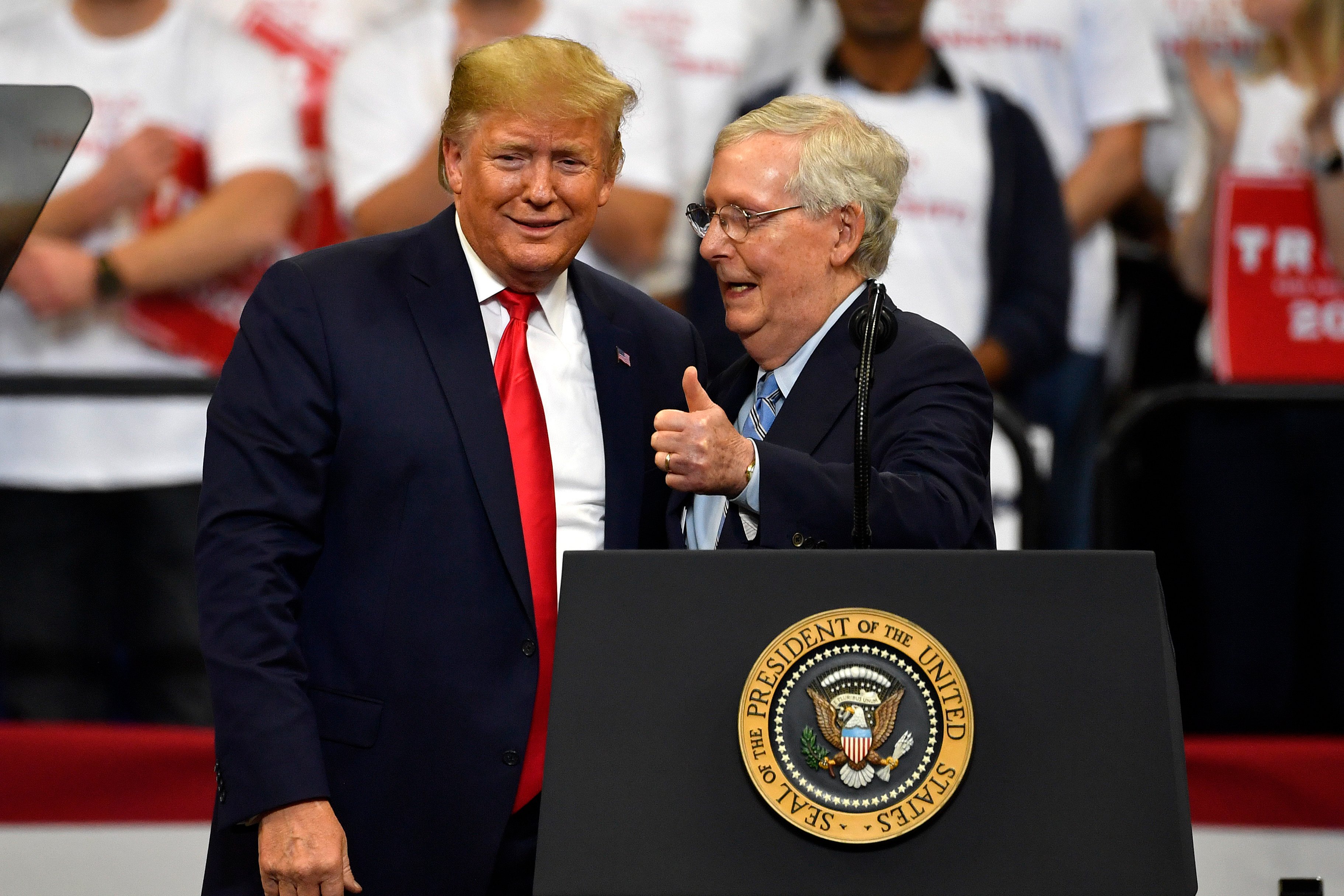 Then US President Donald Trump (left) and Republican Senator Mitch McConnell greet each other during a campaign rally in Lexington, Kentucky, in November 2019. Photo: AP