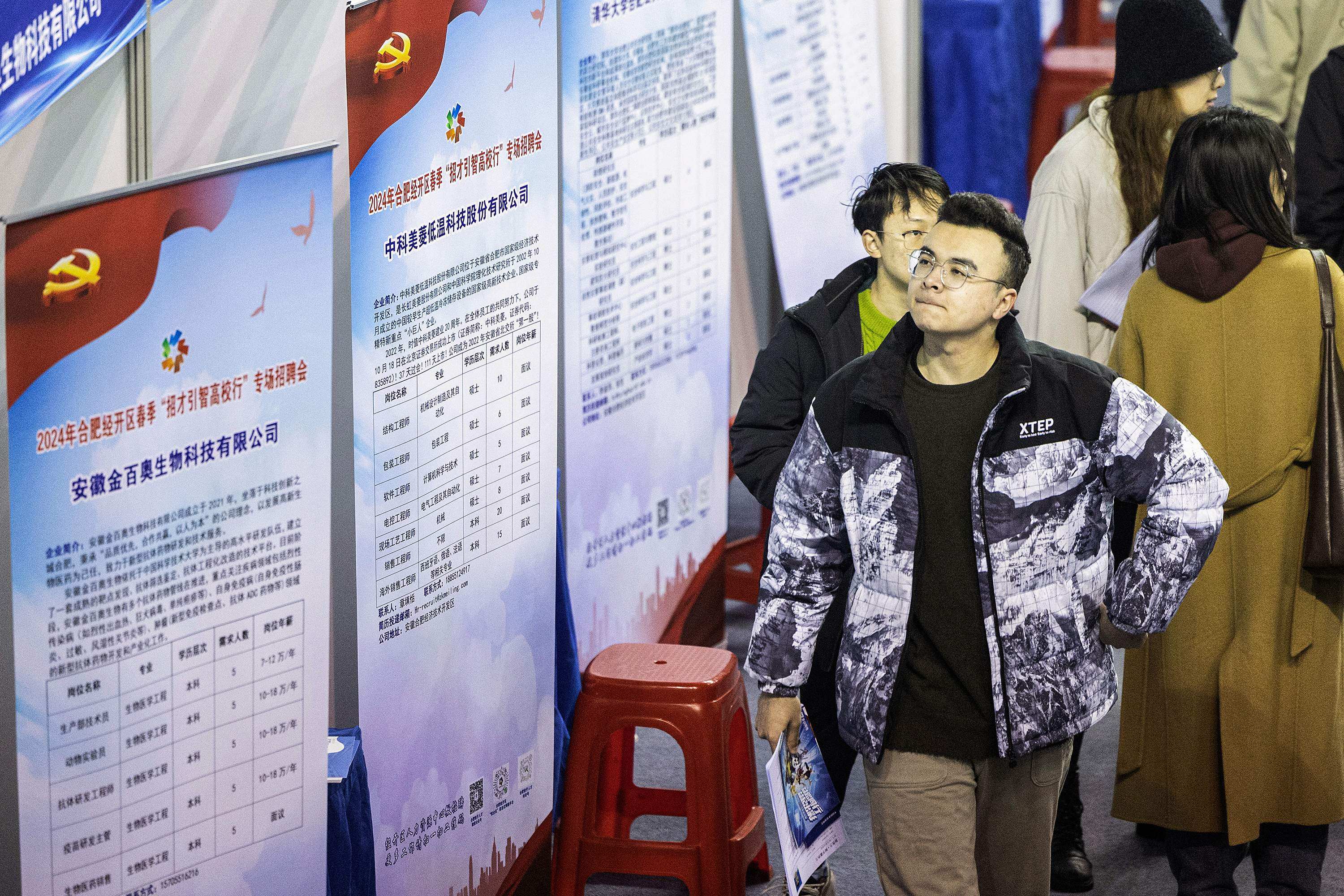 University students attend a job fair in Wuhan on March 6. Youth unemployment, the persistent woes of the property sector and a dearth of confidence among domestic consumers and foreign investors are just some of the hurdles between China’s policymakers and their goal of 5 per cent GDP growth in 2024. Photo: AFP