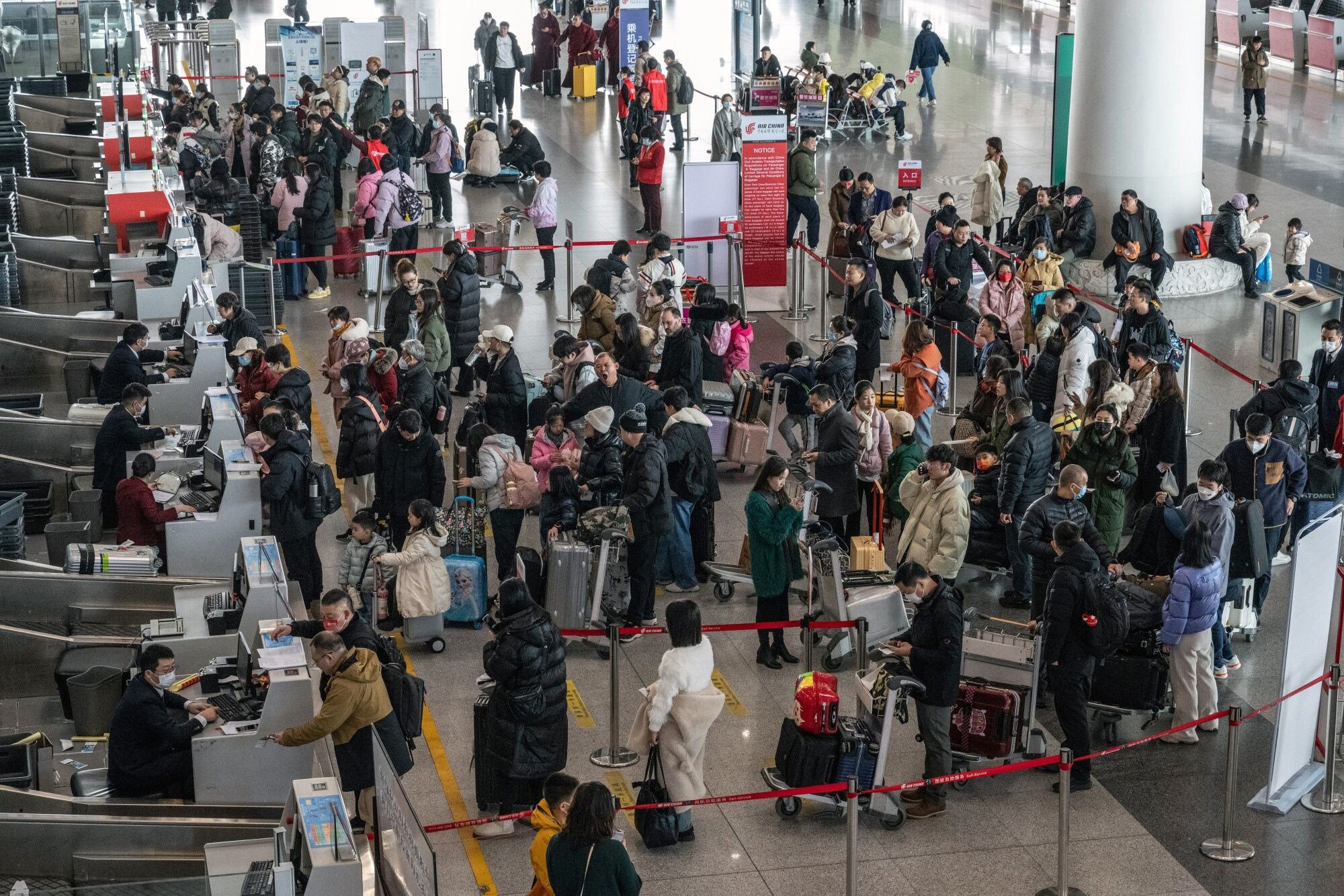Travelers at Beijing Capitol Airport. US and China are trying to increase academic exchanges, but US State Department officials say Beijing is dampening foreign student programmes. Photo: Bloomberg