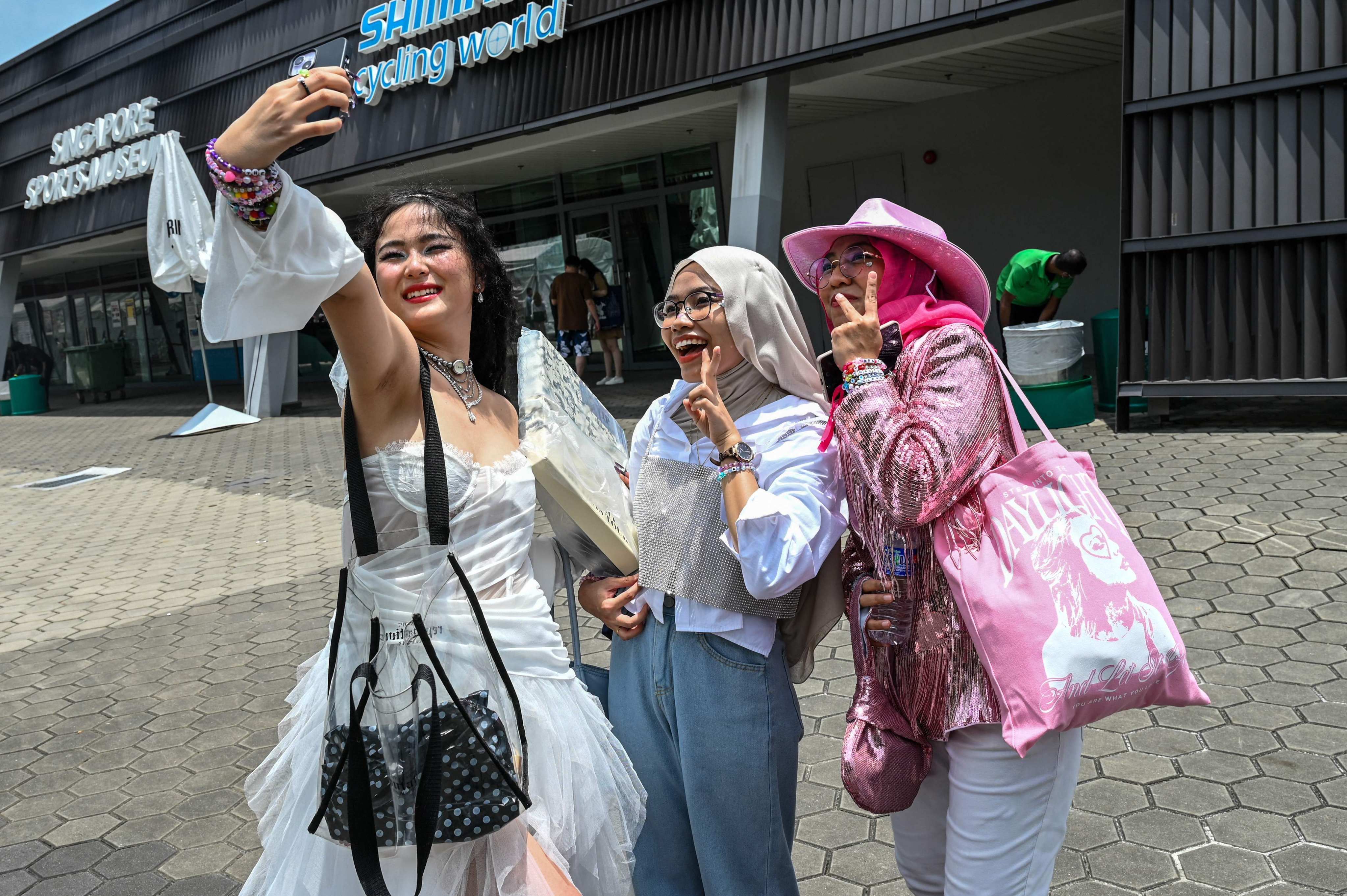 Fans of US singer Taylor Swift take a selfie as they arrive for her concert at the National Stadium in Singapore on March 7. Photo: AFP