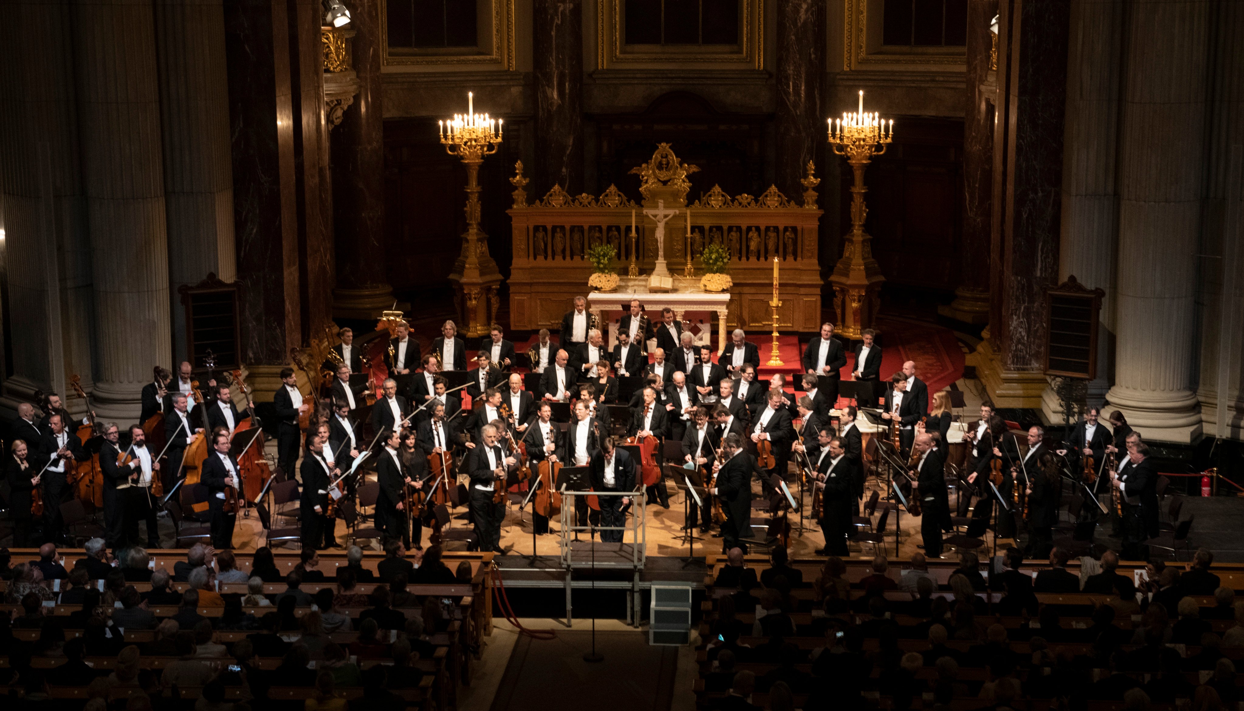 Members of the Vienna Philharmonic after a performance in Berlin Cathedral. The orchestra, which was all male until 1997, now has 24 woman players. Photo: Getty Images