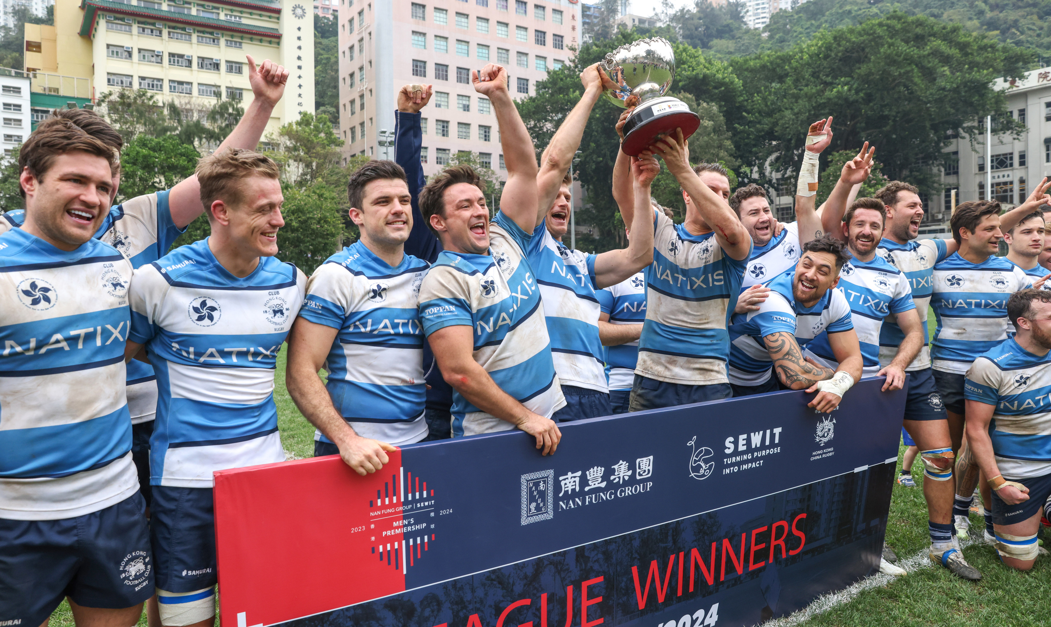 Hong Kong Football Club players celebrate with the trophy on Saturday. Photo: Yik Yeung-man