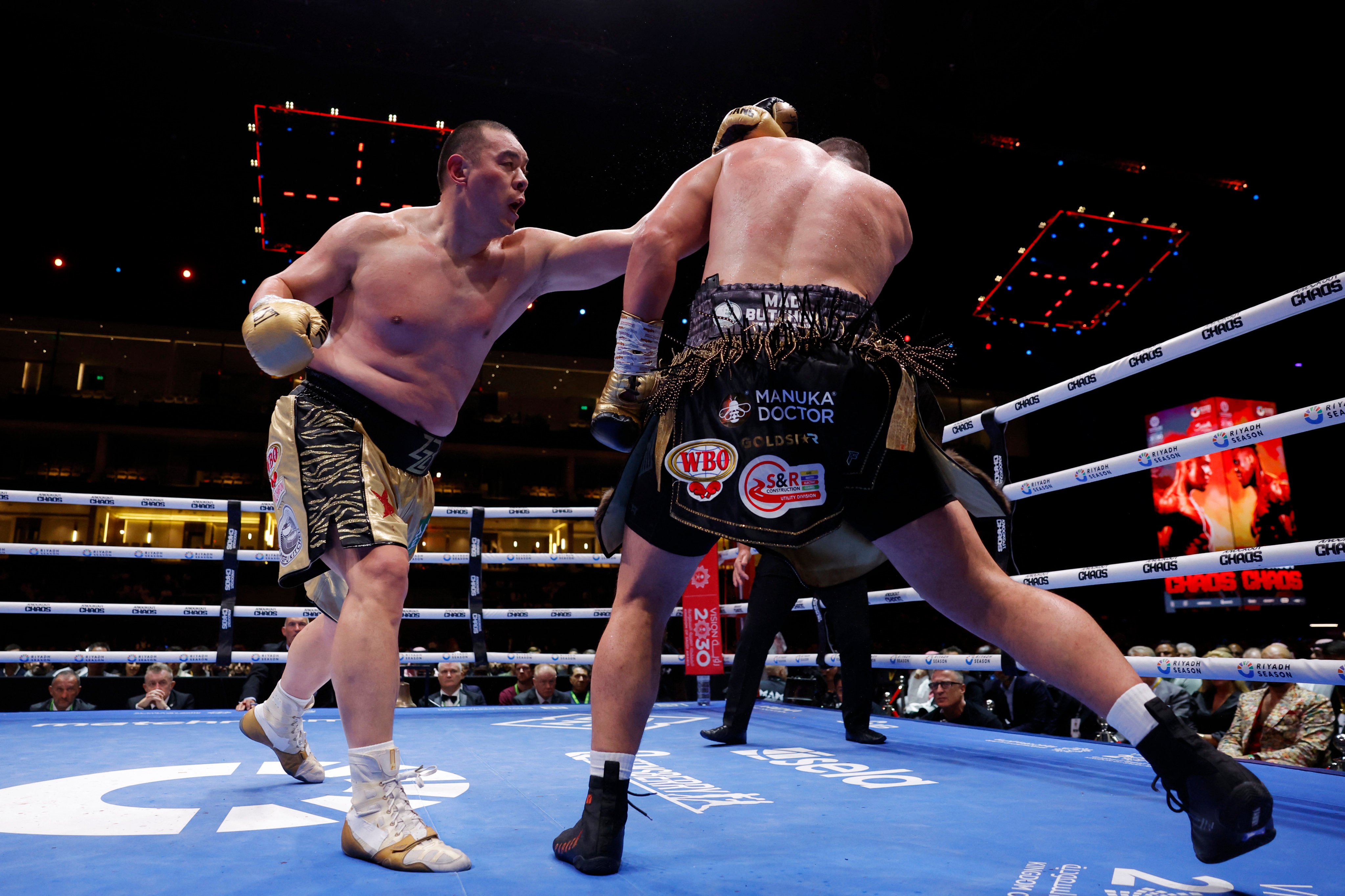Zhang Zhilei lands a punch on Joseph Parker at the Kingdom Arena. Photo: Reuters