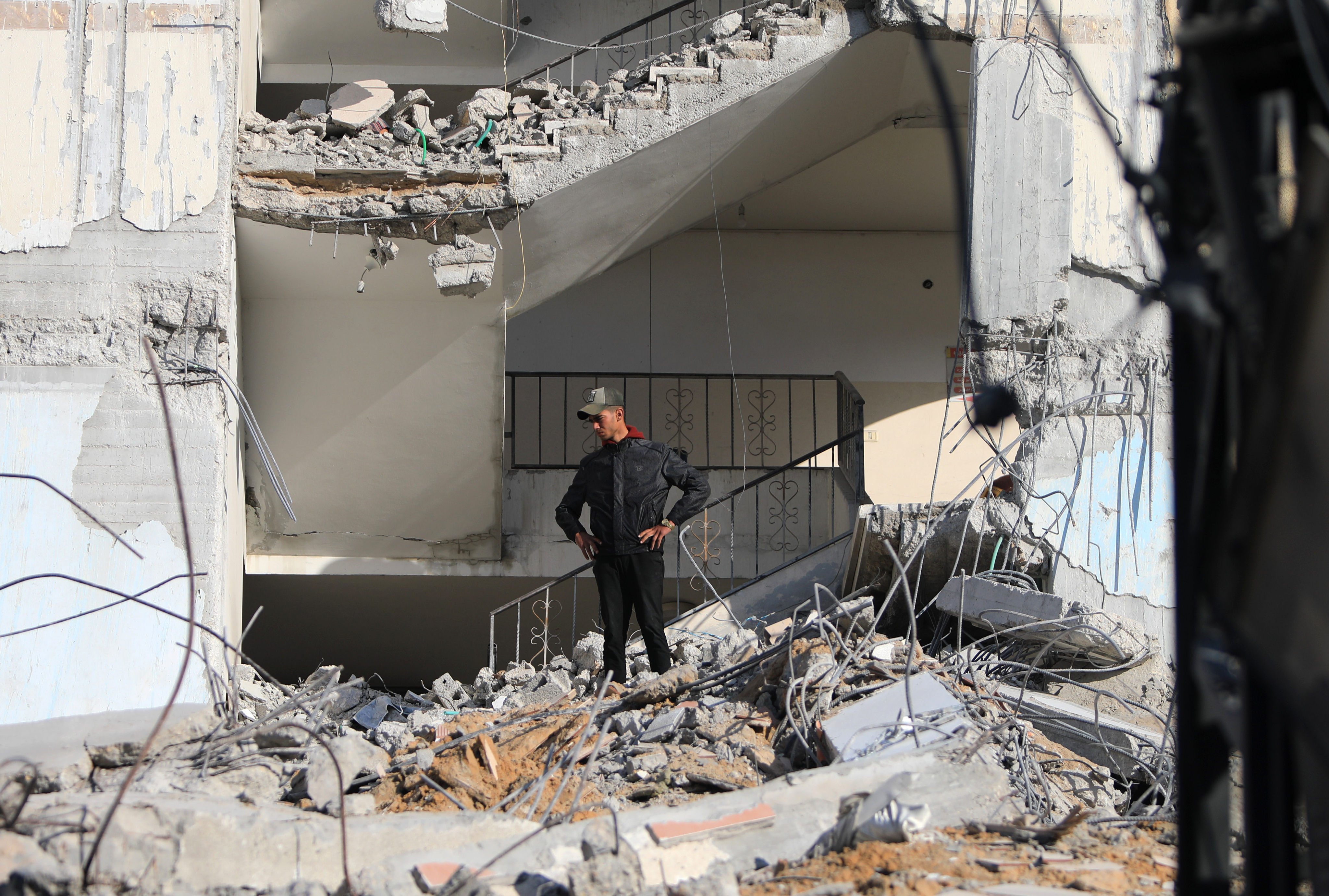A Palestinian inspects destroyed buildings after intense airstrikes in the southern Gaza Strip city of Rafah. Photo: Xinhua