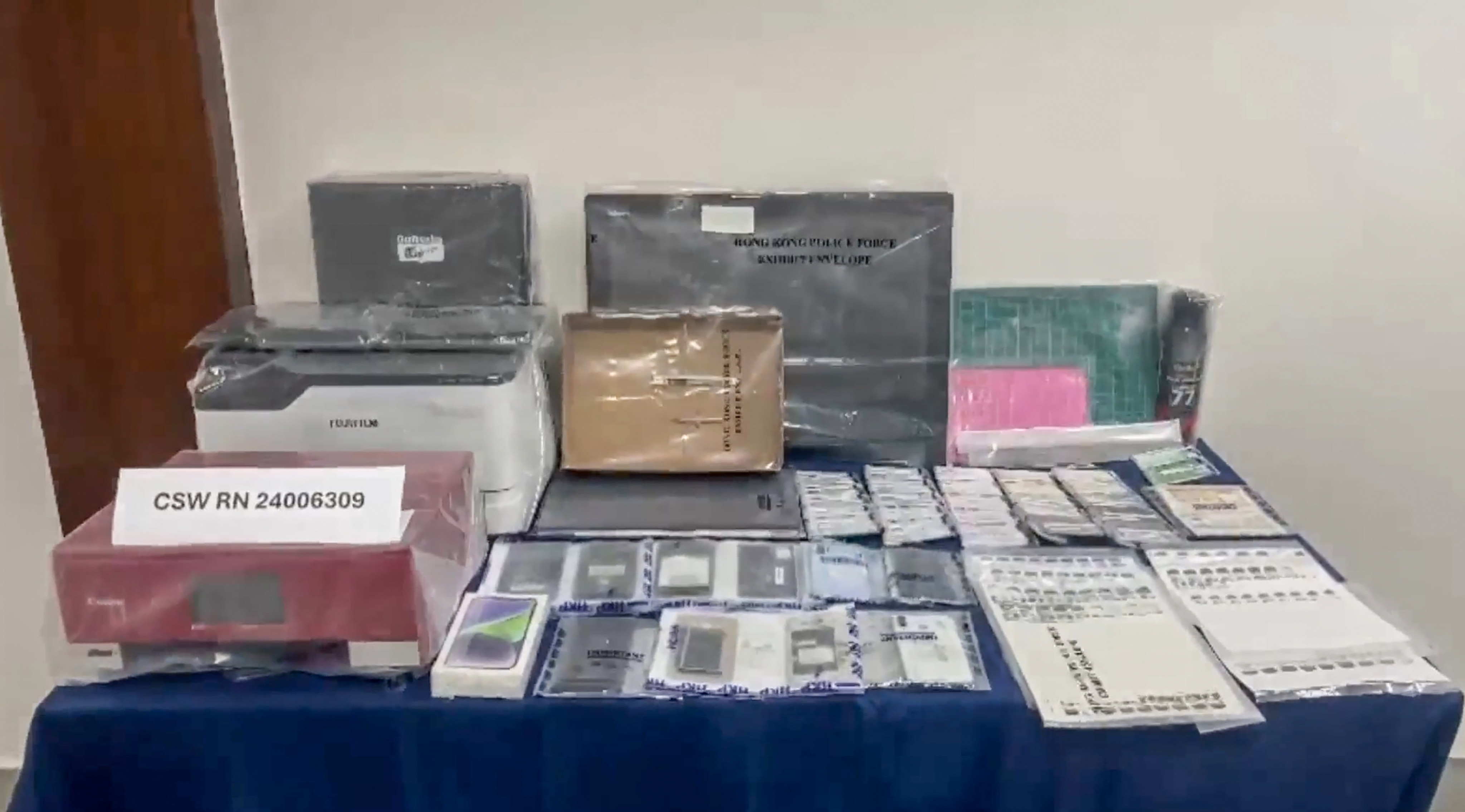 Police seize documents including Hong Kong identity cards, mainland China travel permits, bank cards, driving licences and construction safety training certificates. Photo: Handout