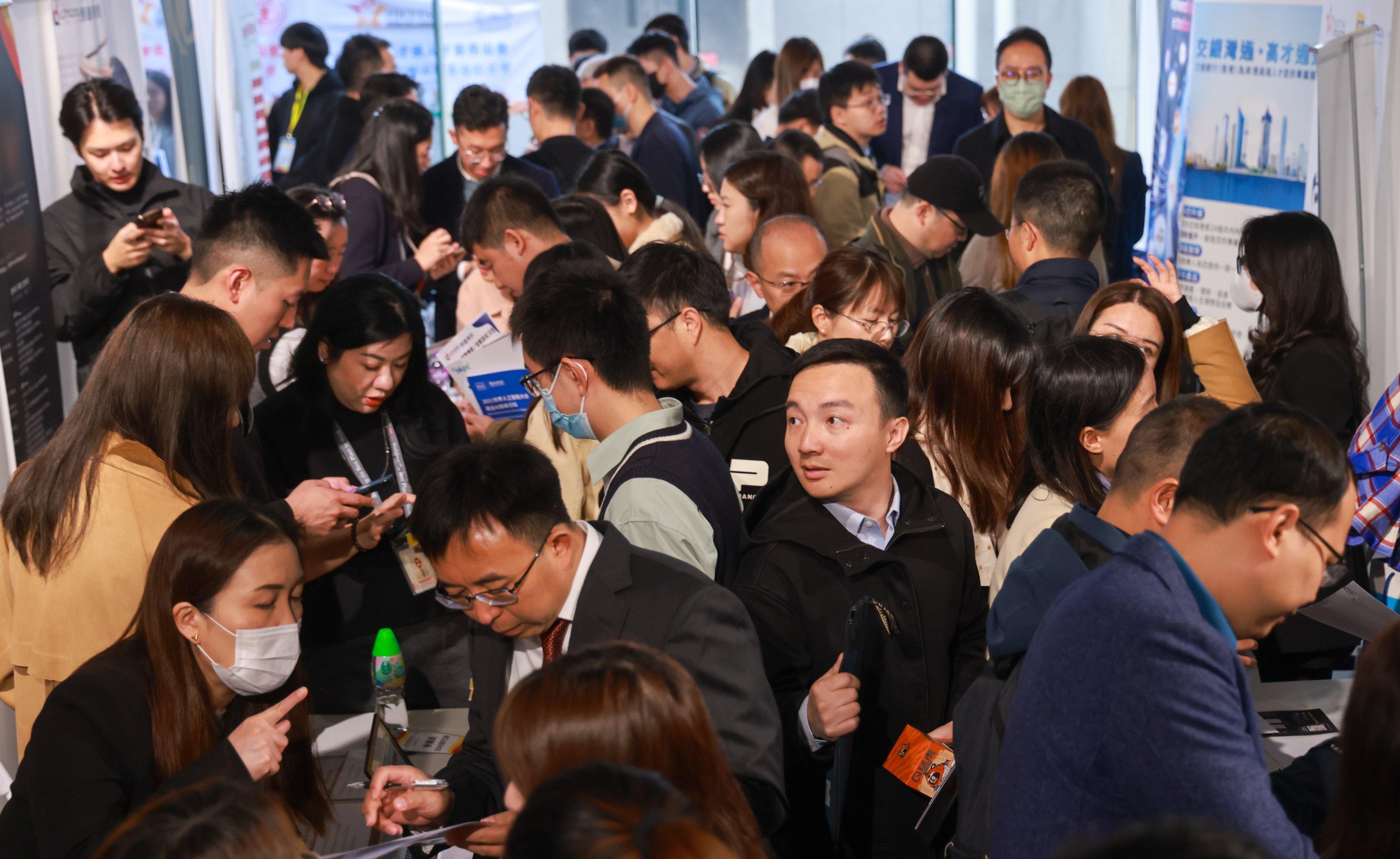 Job seekers line up to enter the 2024 Hong Kong Top Talent Recruitment Fair, hosted by the Hong Kong Top Talent Services Association at Shun Tak Centre in Sheung Wan. Photo:     SCMP / May Tse