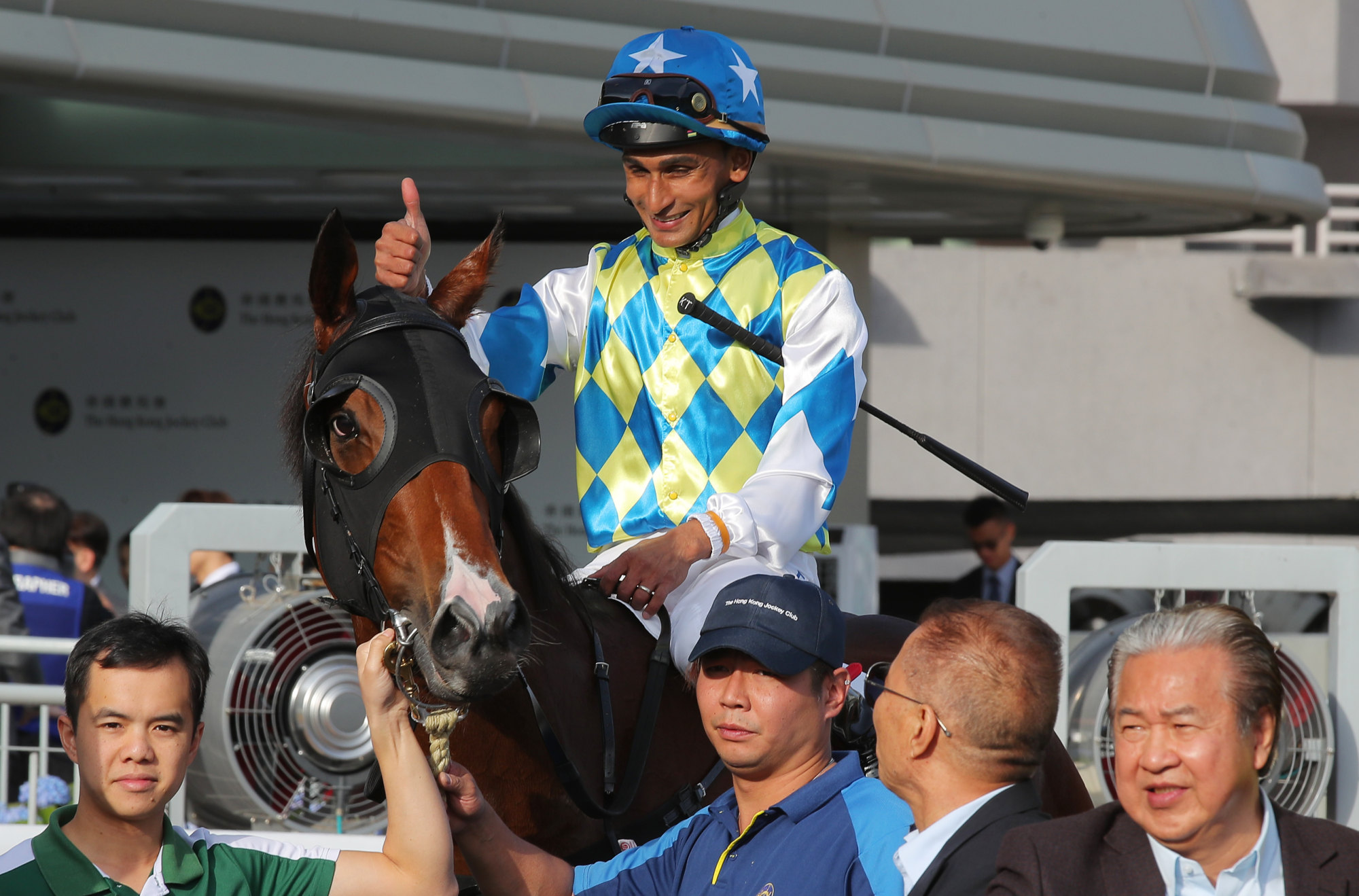 Owner Yeung Kin-man (right) celebrates after one of Galaxy Patch’s successes.