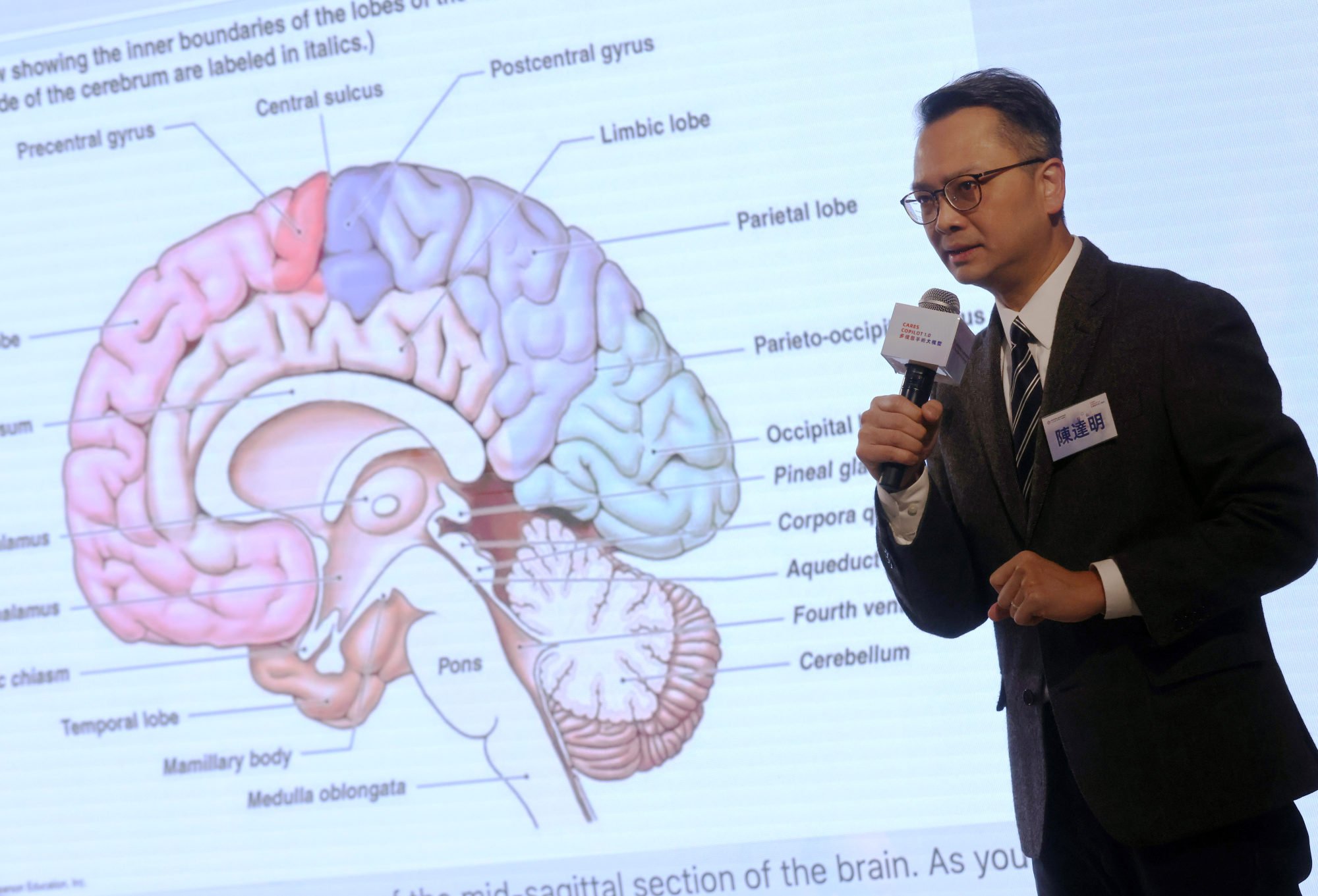 Danny Chan Tat-ming, head of the neurosurgery division at the Department of Surgery in the Chinese University of Hong Kong, shows the capabilities of the CARES Copilot 1.0 artificial intelligence model at a press conference held in the Hong Kong Science Park on Monday. Photo: Jonathan Wong