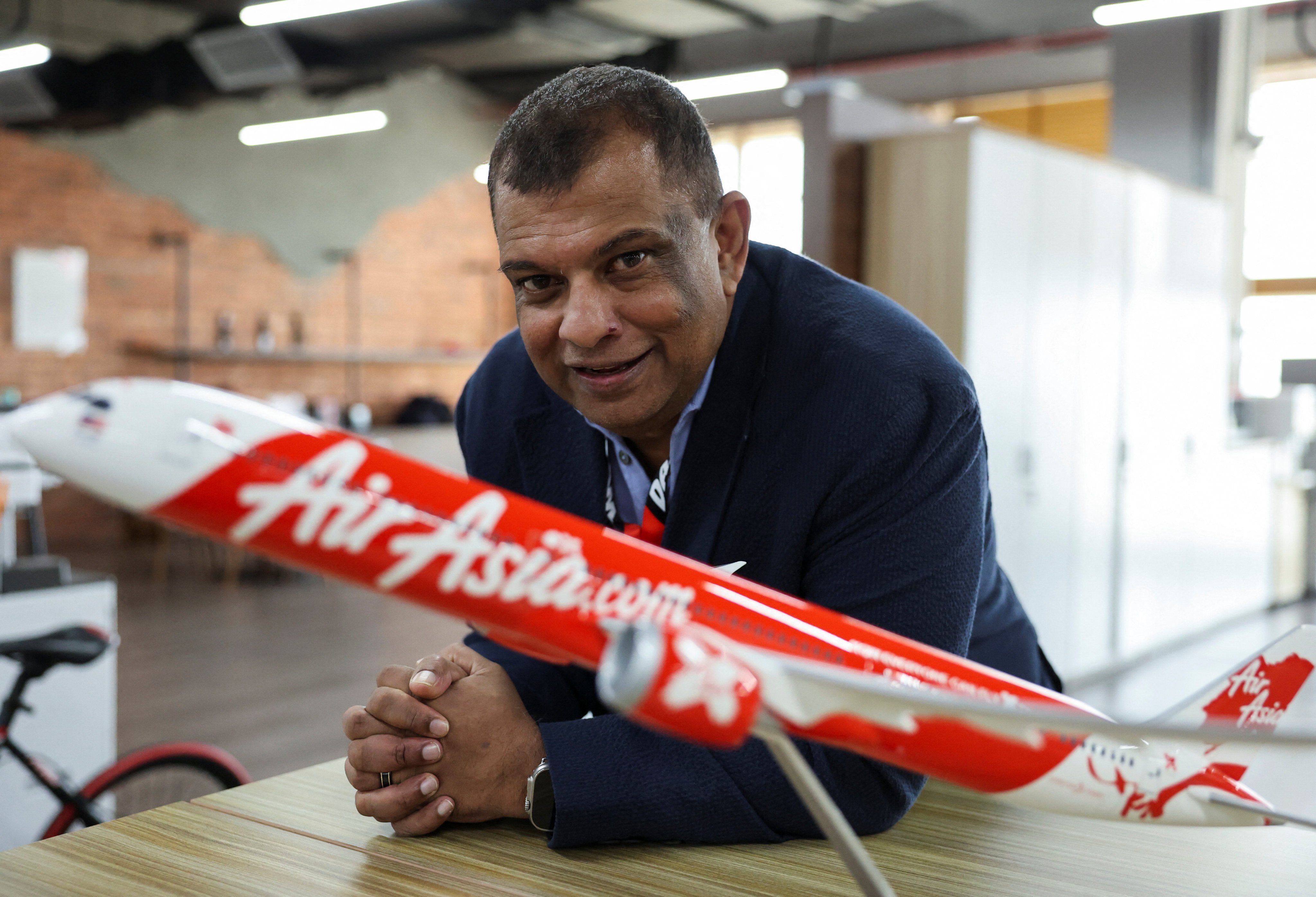 Tony Fernandes, the CEO of AirAsia has no regrets of a viral picture of him attending a meeting without a shirt. Photo: Reuters