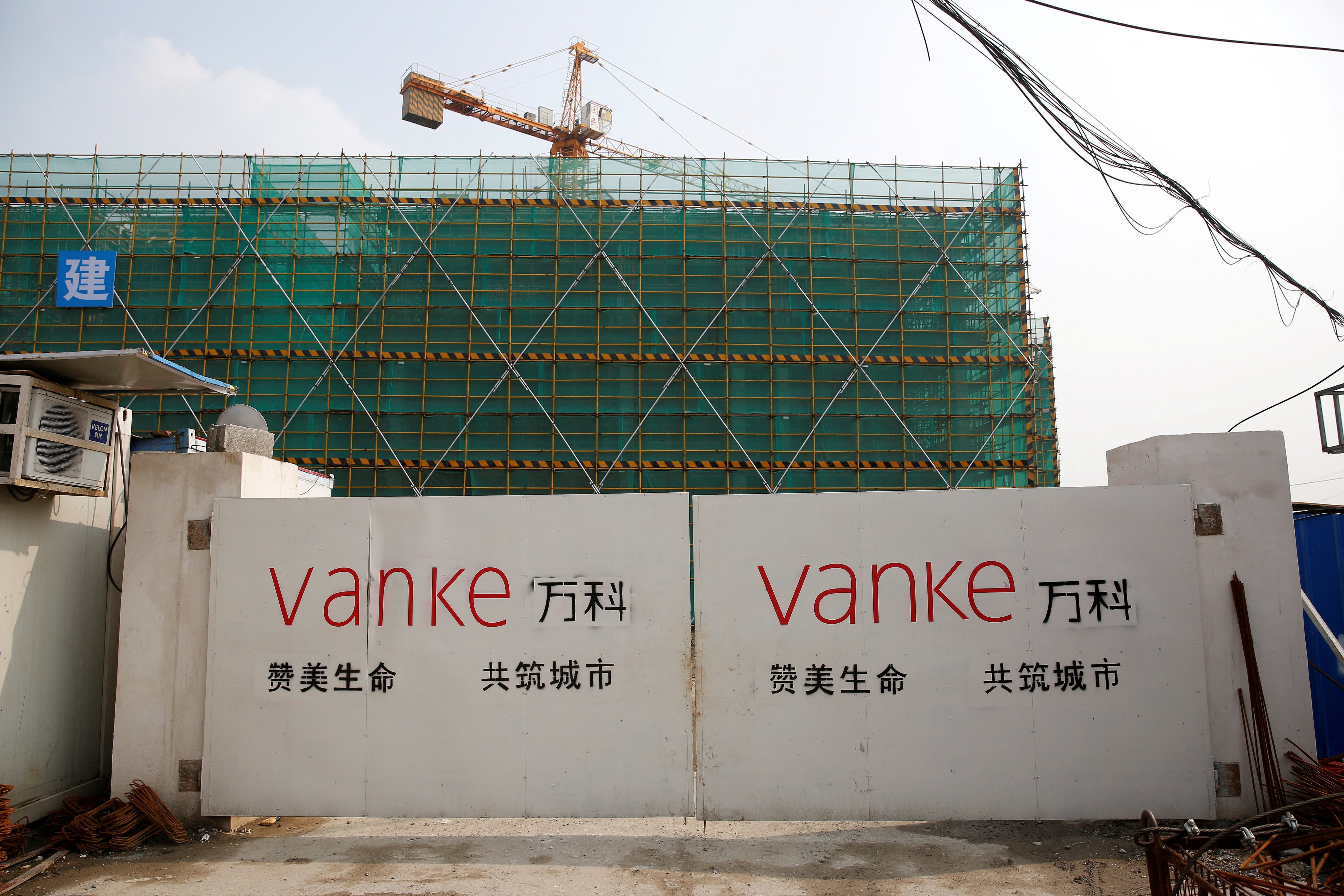 The logo of property developer China Vanke is seen at a construction site in Shanghai. Photo: Reuters