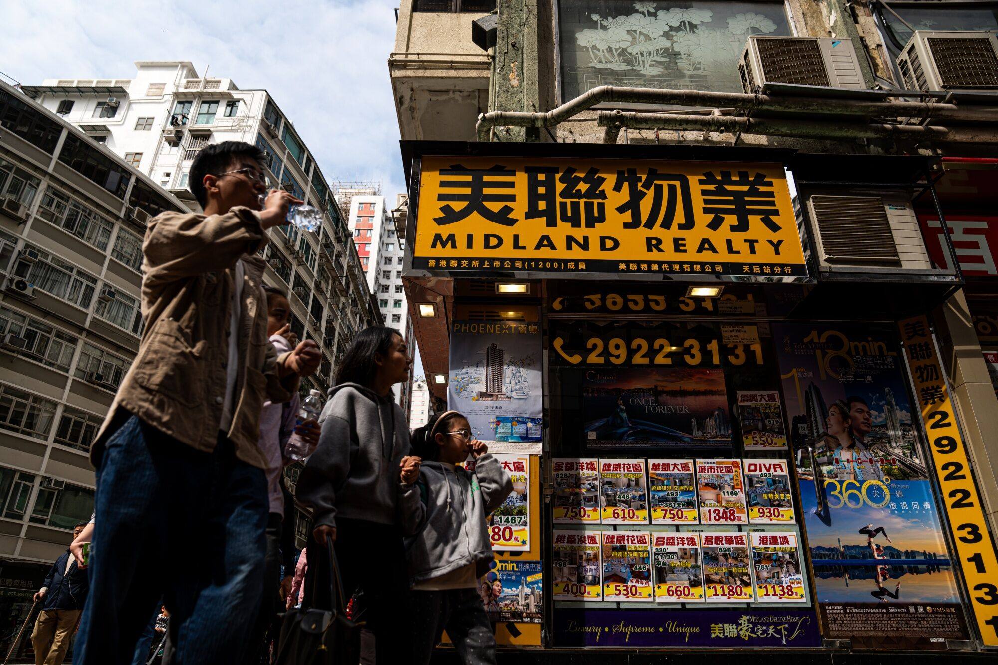 Listings for residential properties for sale are seen at a Midland Holdings Ltd. store in Hong Kong. File photo: Bloomberg