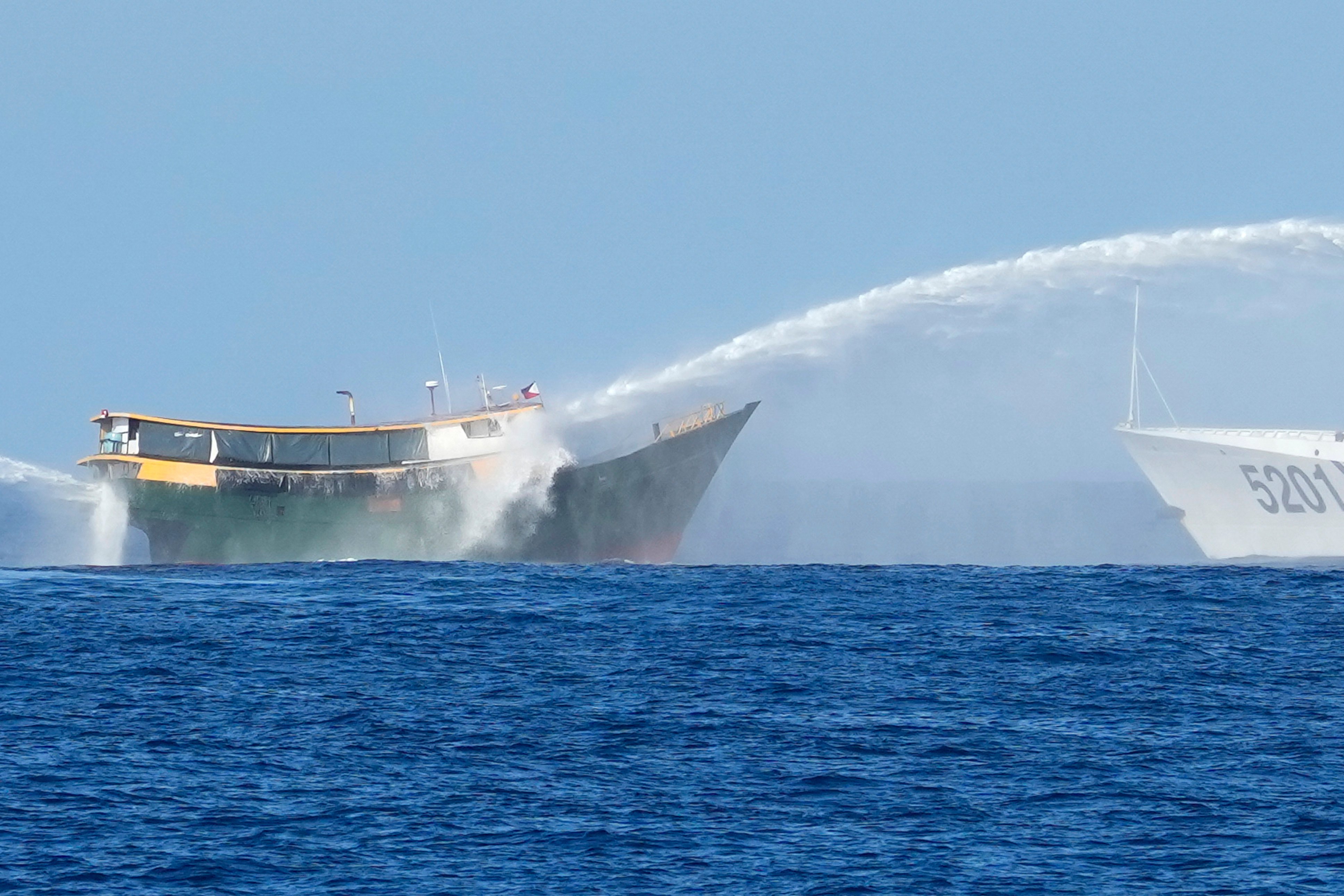A Philippine resupply vessel is hit by Chinese coastguard water cannons as it tries to enter the Second Thomas Shoal on March 5. Photo: AP 